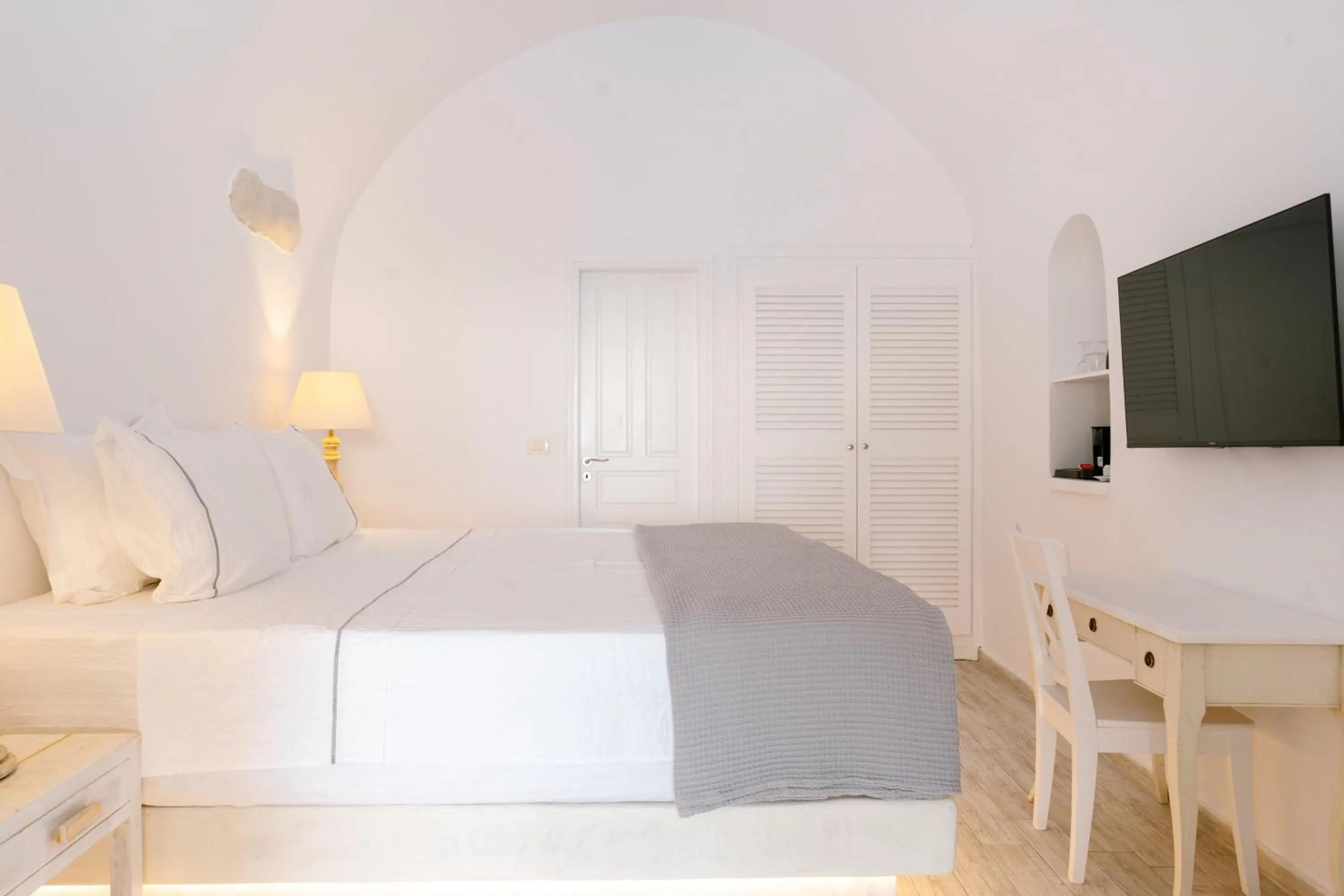 Bed in Anemos Cave Suites