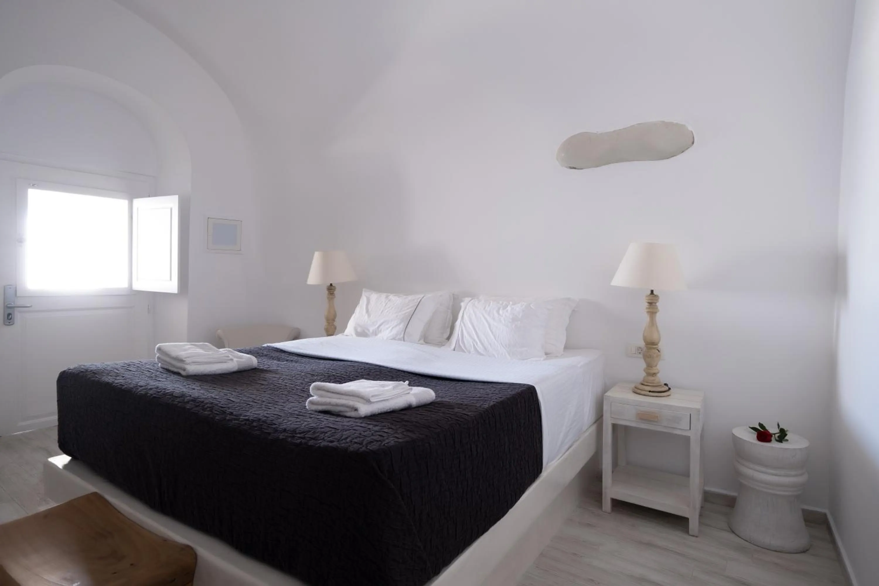 Bed in Anemos Cave Suites