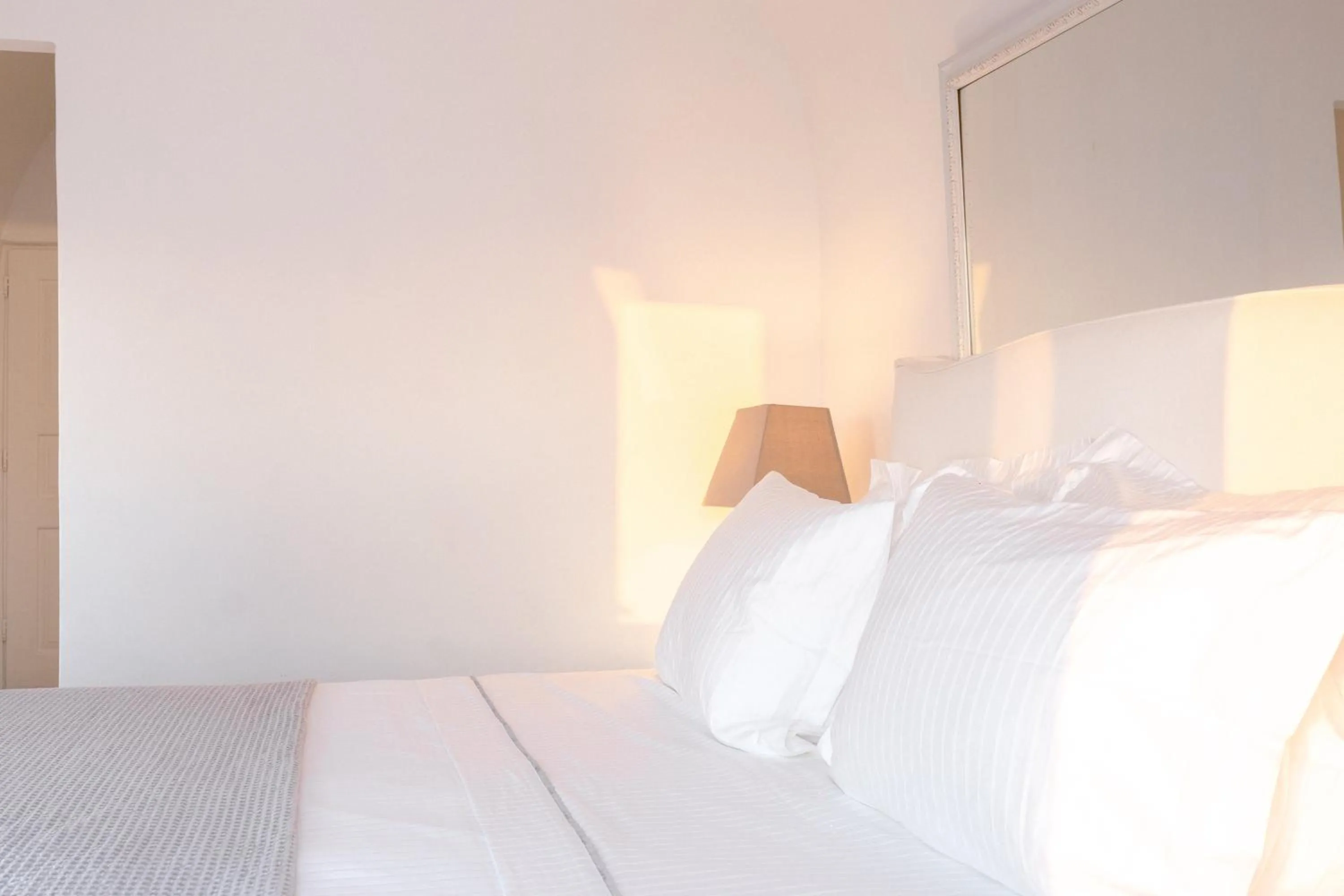 Bed in Anemos Cave Suites