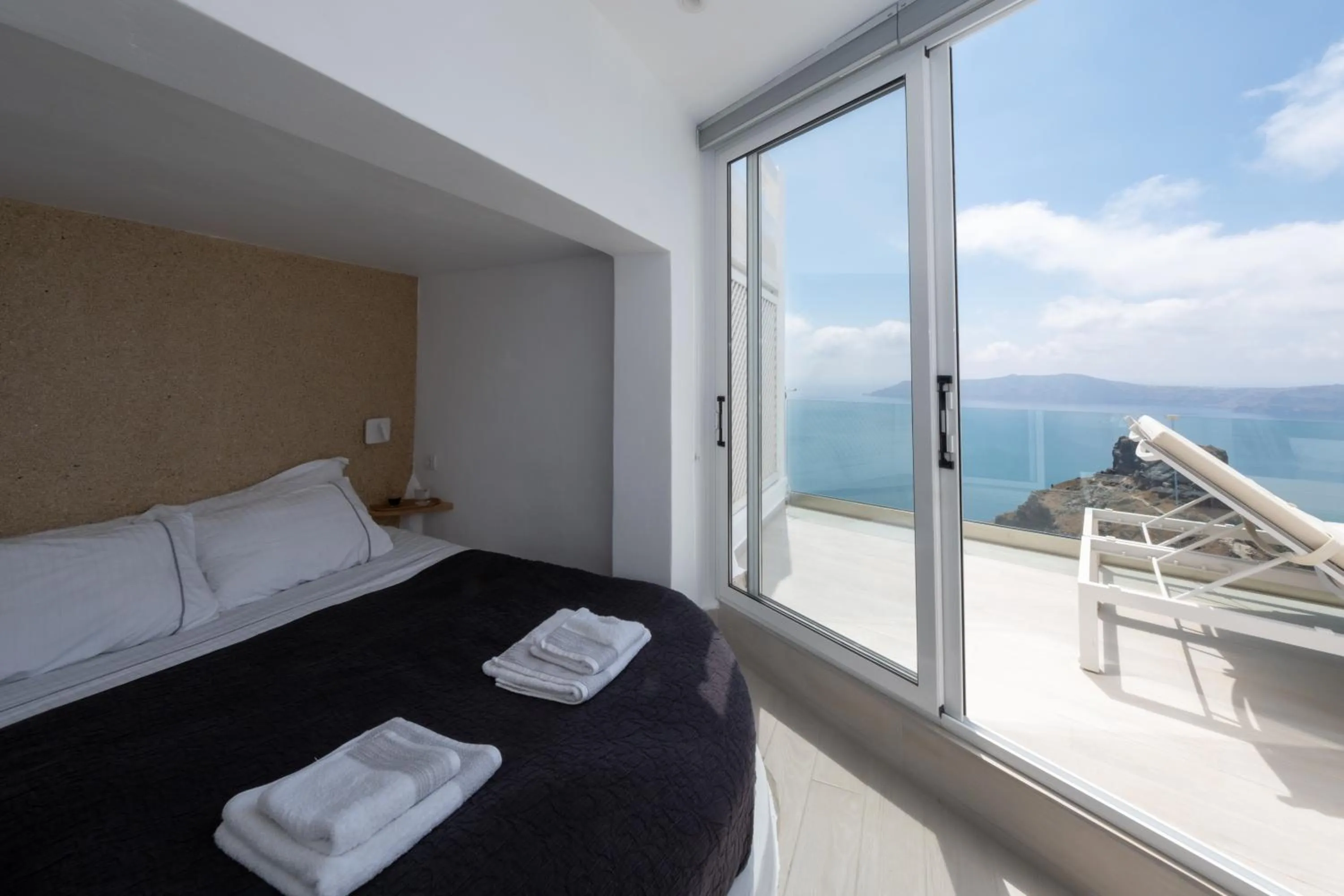 Bed in Anemos Cave Suites