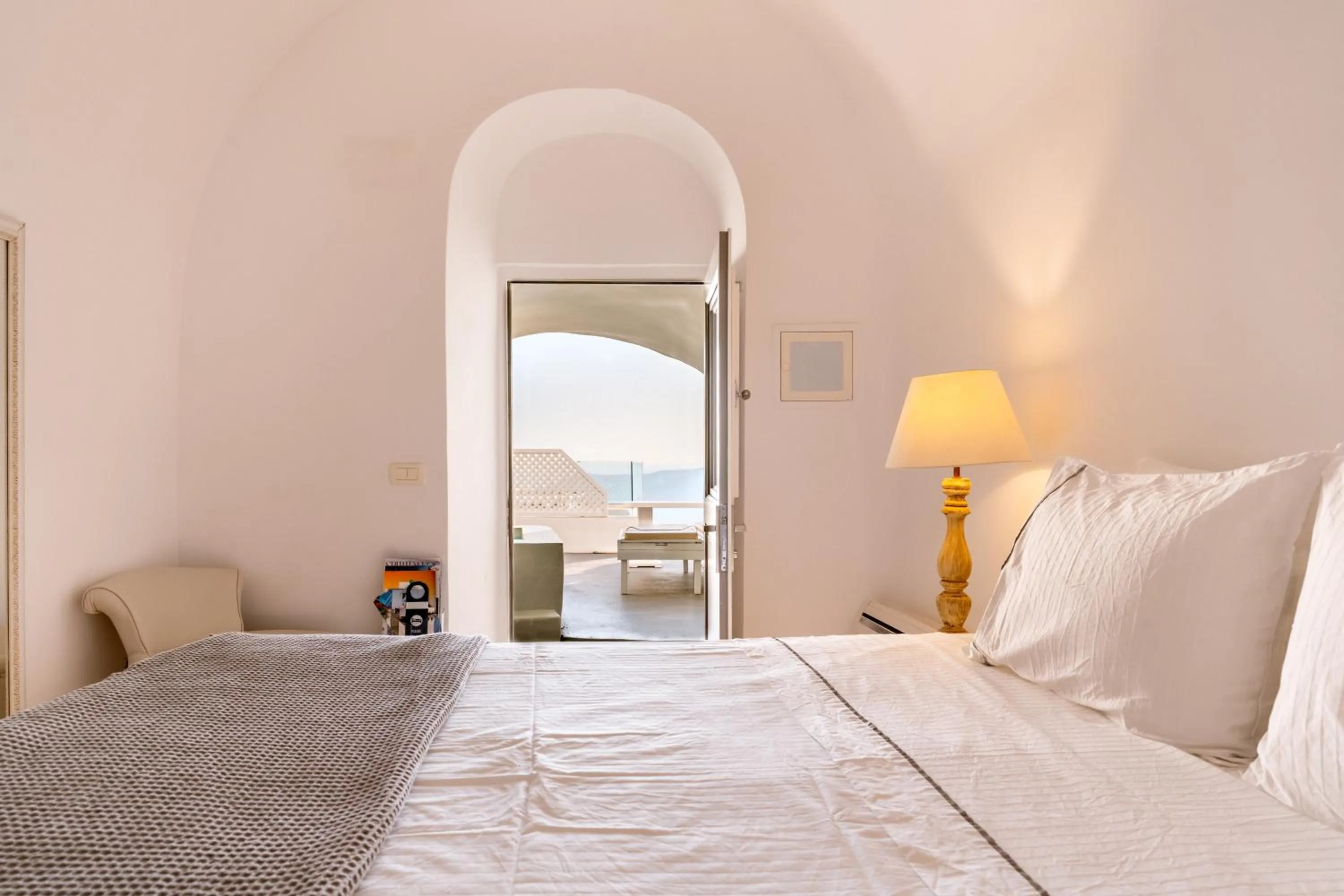 Bed in Anemos Cave Suites