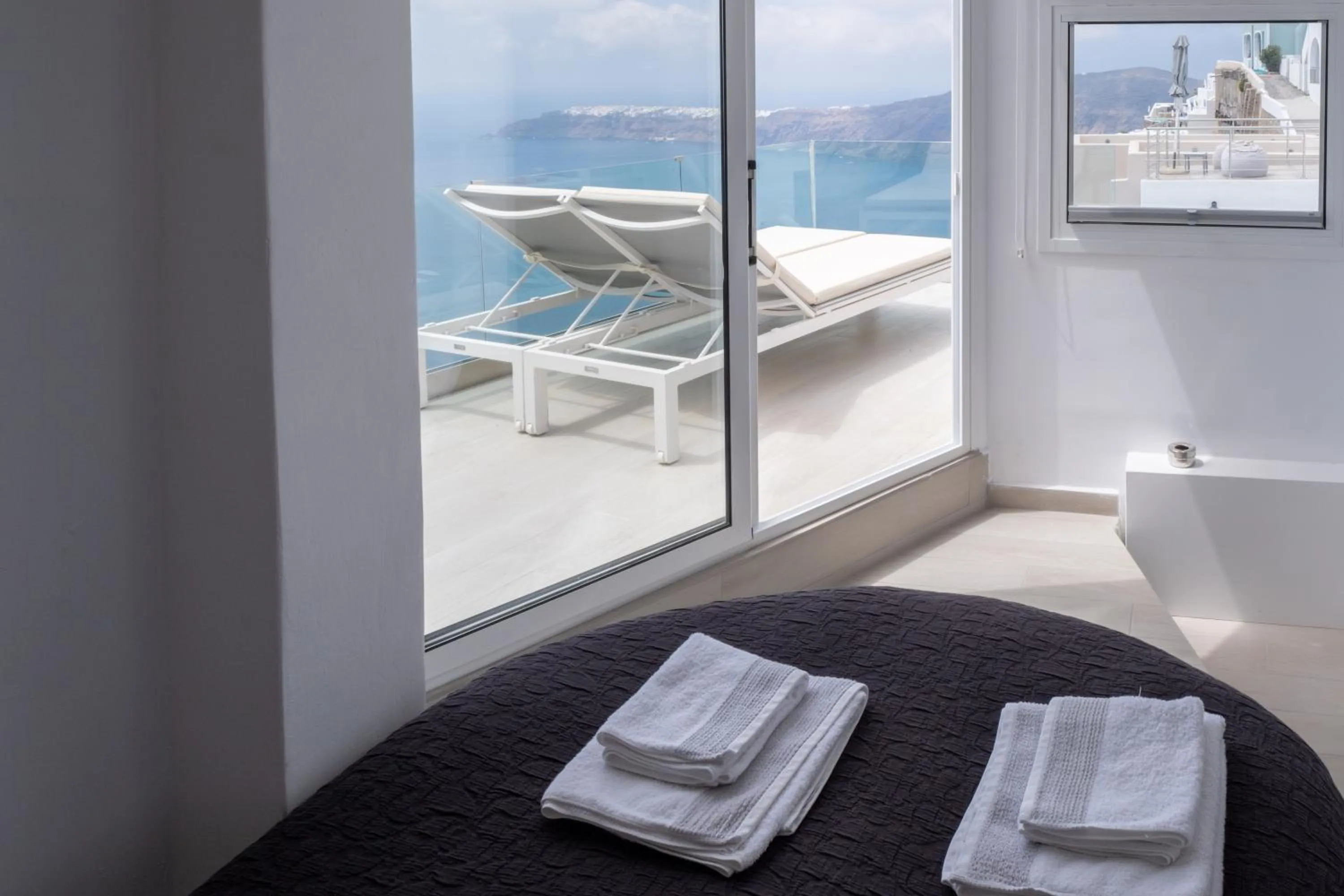 Bed in Anemos Cave Suites