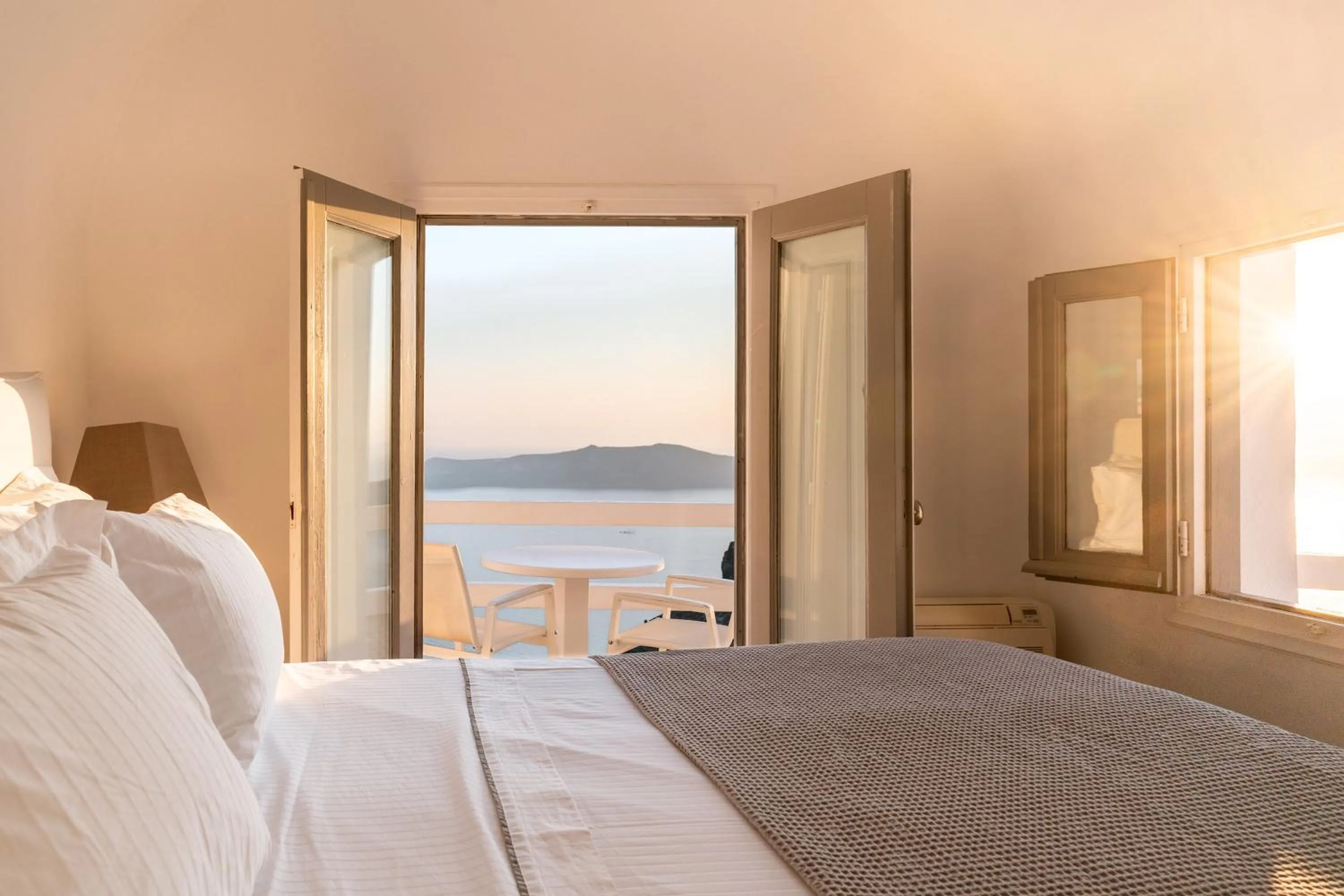 Bed in Anemos Cave Suites