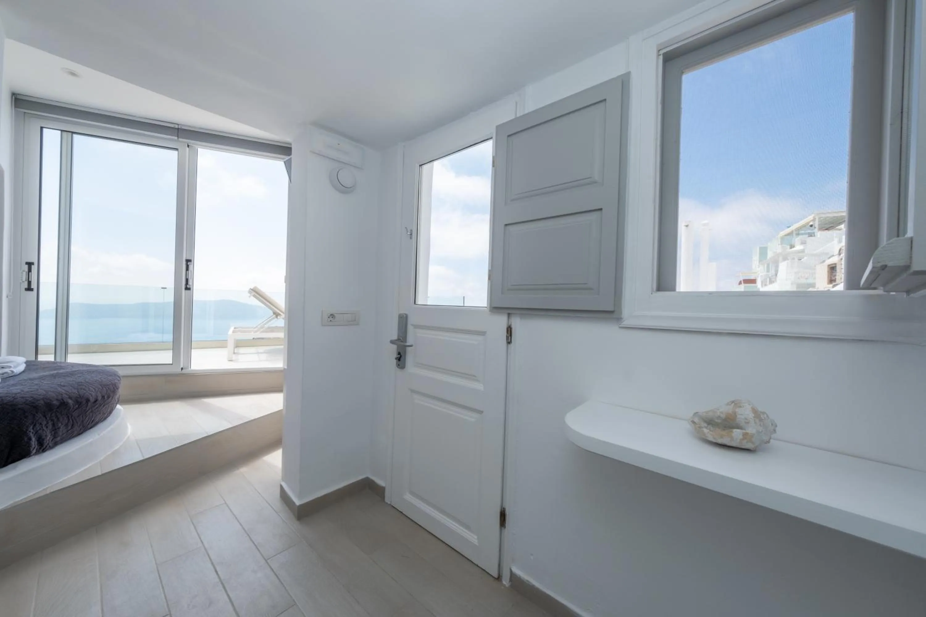 Bed in Anemos Cave Suites