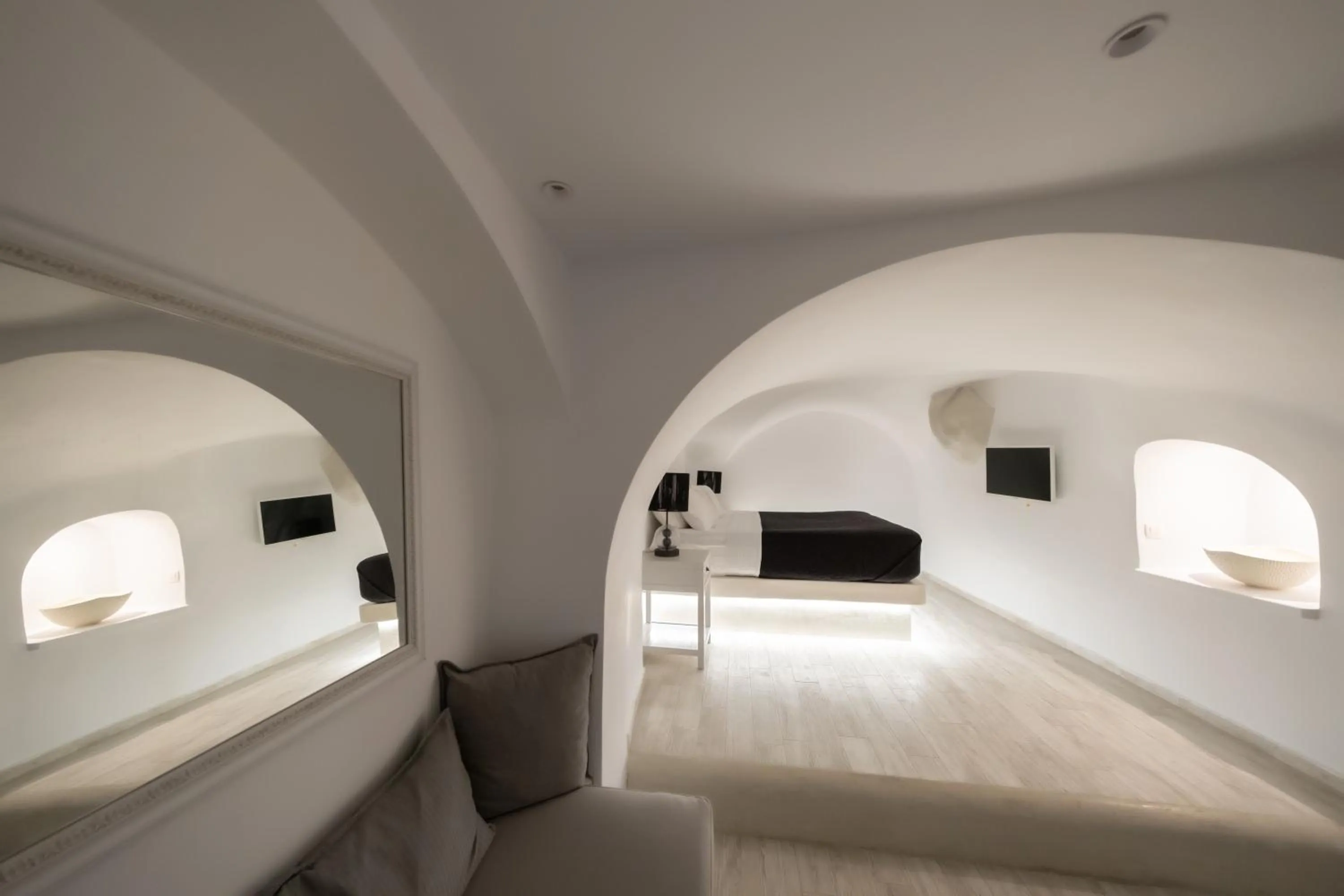 Bed in Anemos Cave Suites