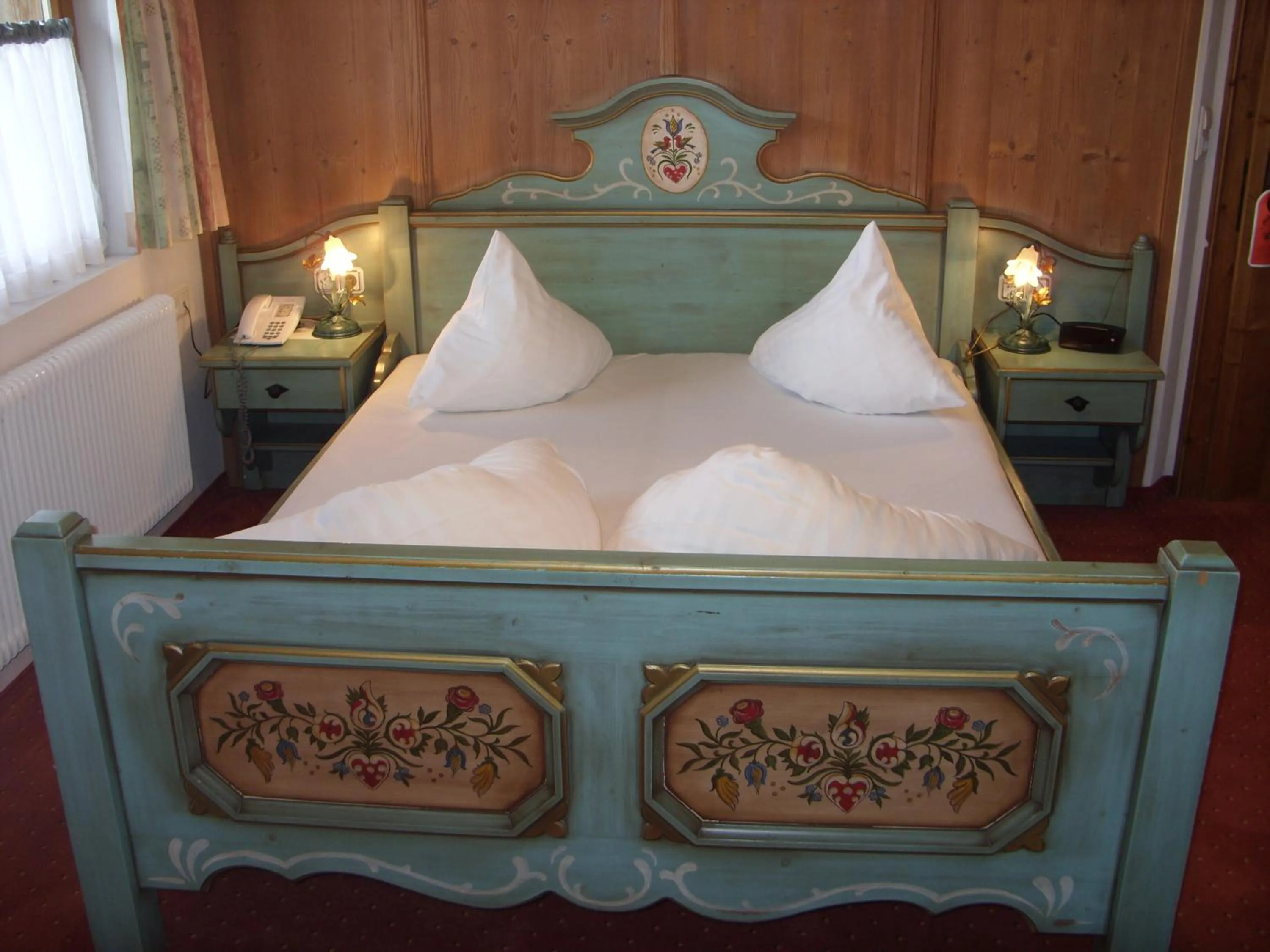 Bed in Hotel Restaurant Hexenalm