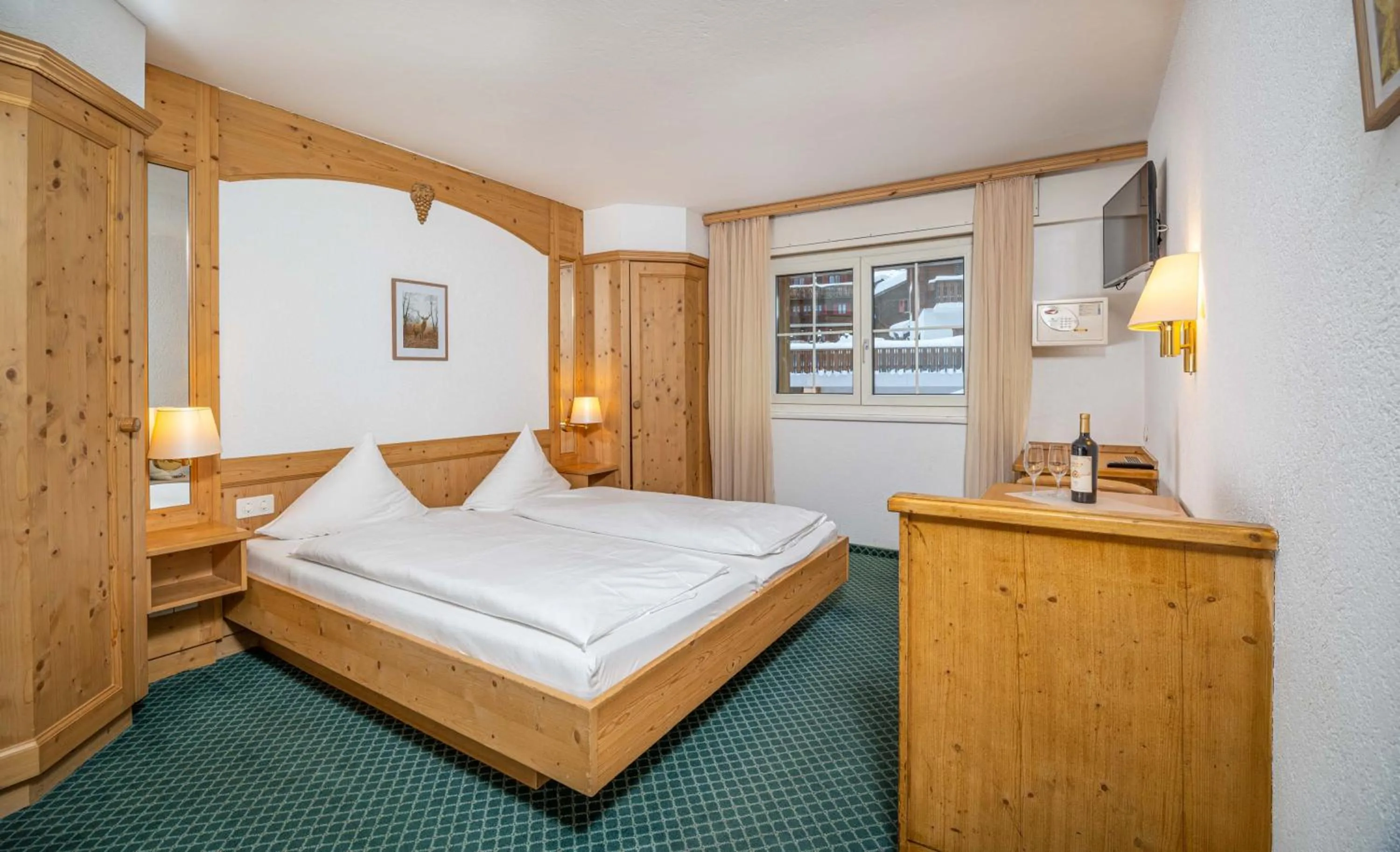 Photo of the whole room, Bed in Grichting Hotel & Serviced Apartments