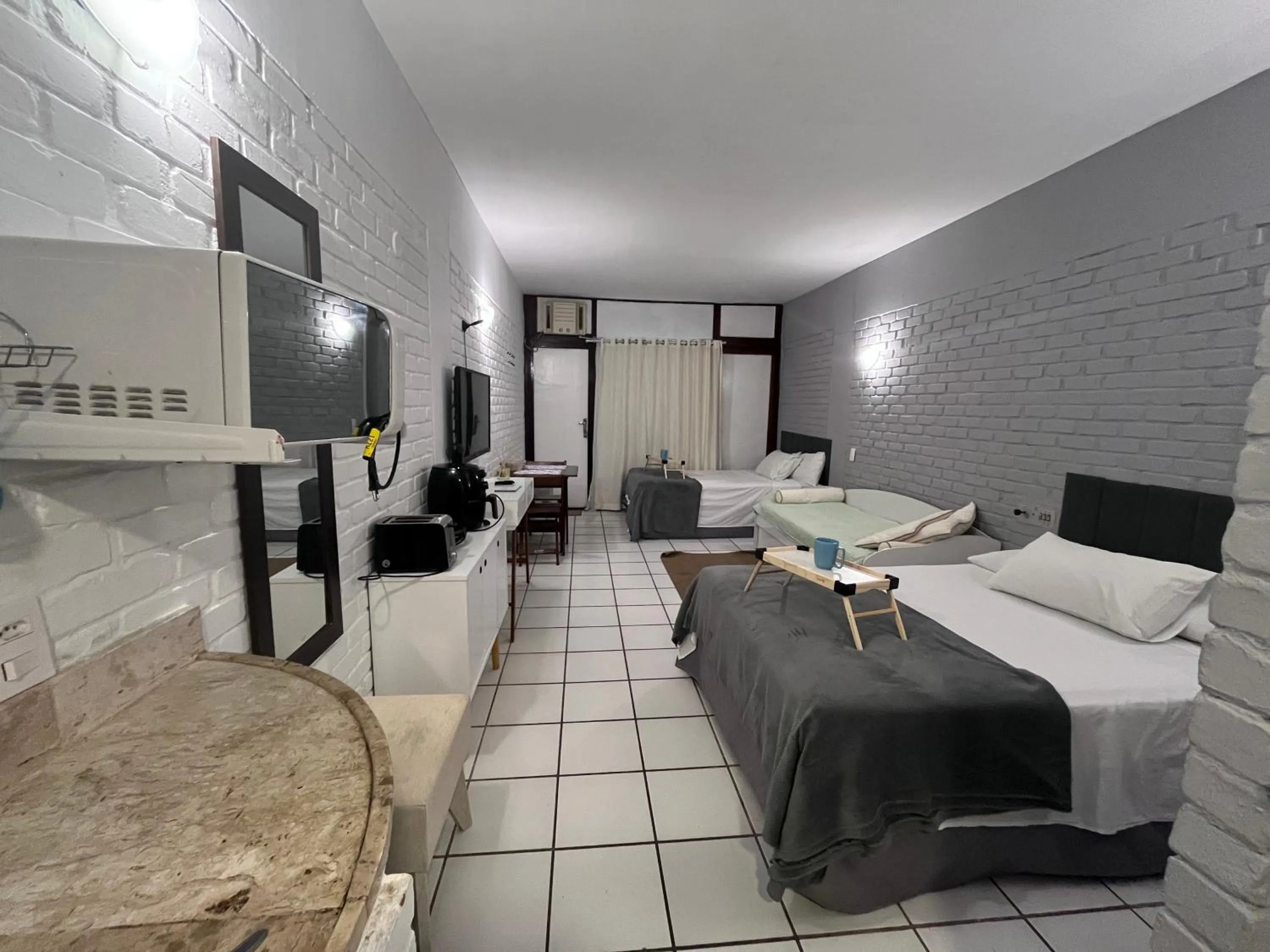 Bed in Angra dos Reis Flat Suíte no Portogalo