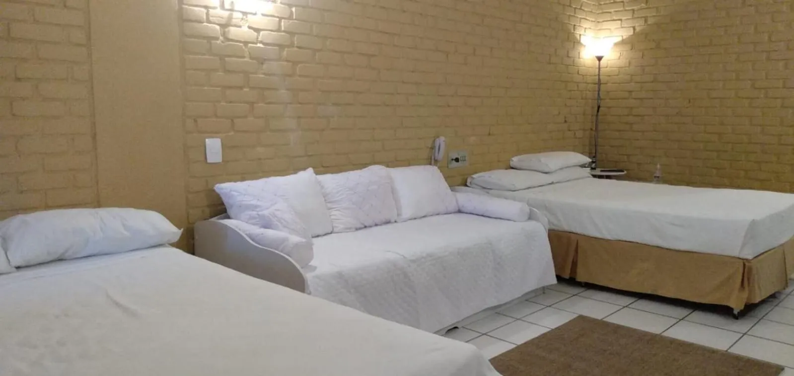 Bed in Angra dos Reis Flat Suíte no Portogalo