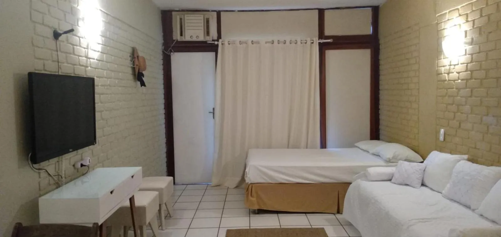 Bed in Angra dos Reis Flat Suíte no Portogalo