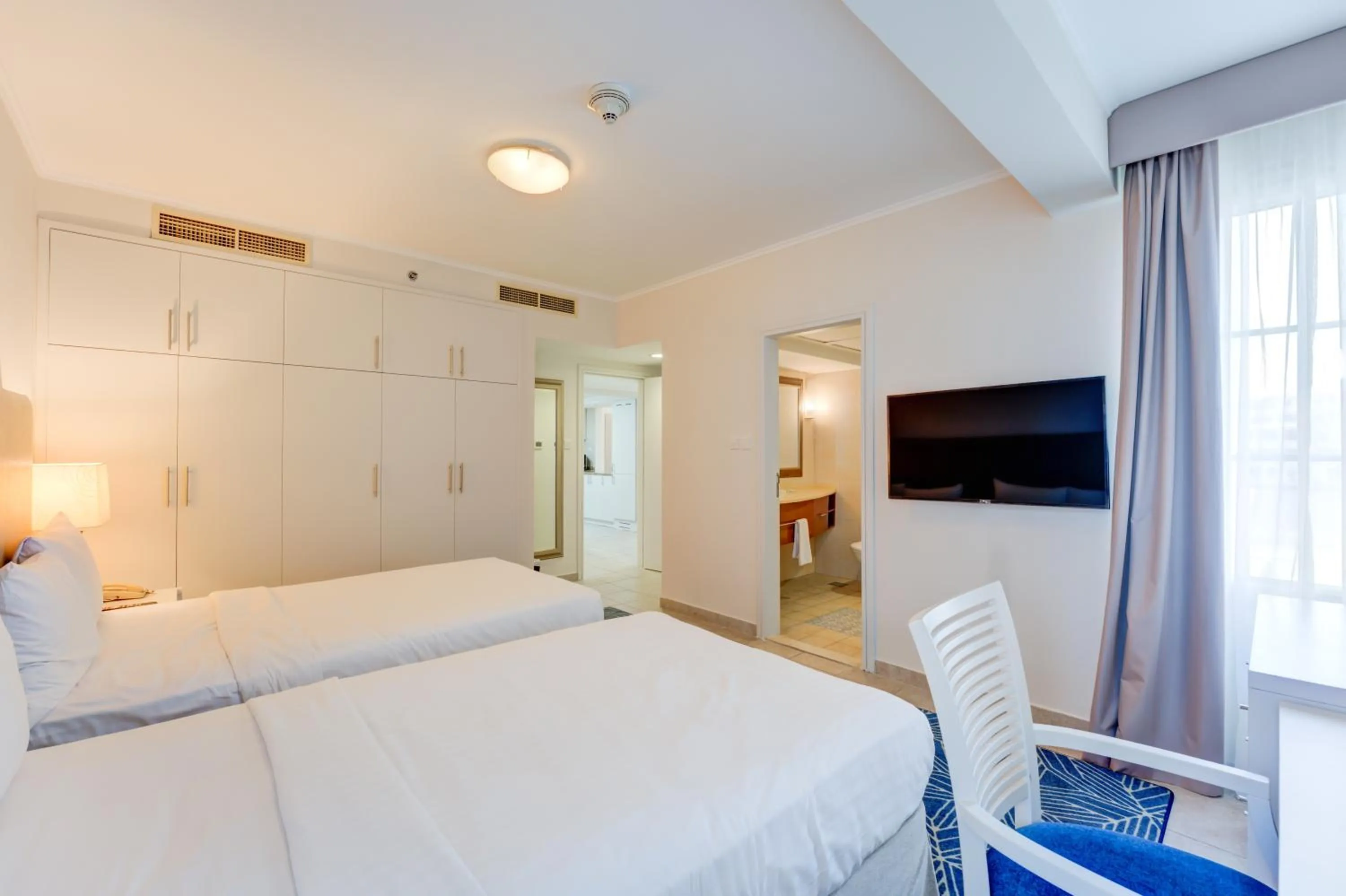 Bedroom, Bed in Millennium Lakeview Residences