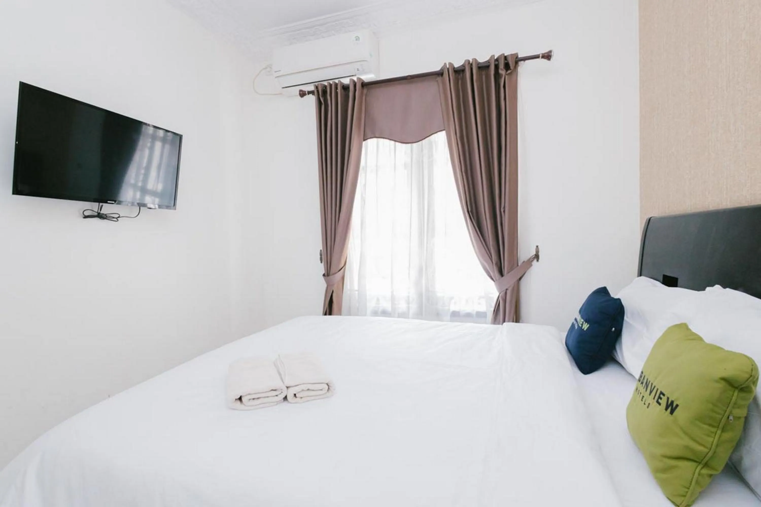 Bed in Urbanview Hotel Sultan Palace Malang by RedDoorz