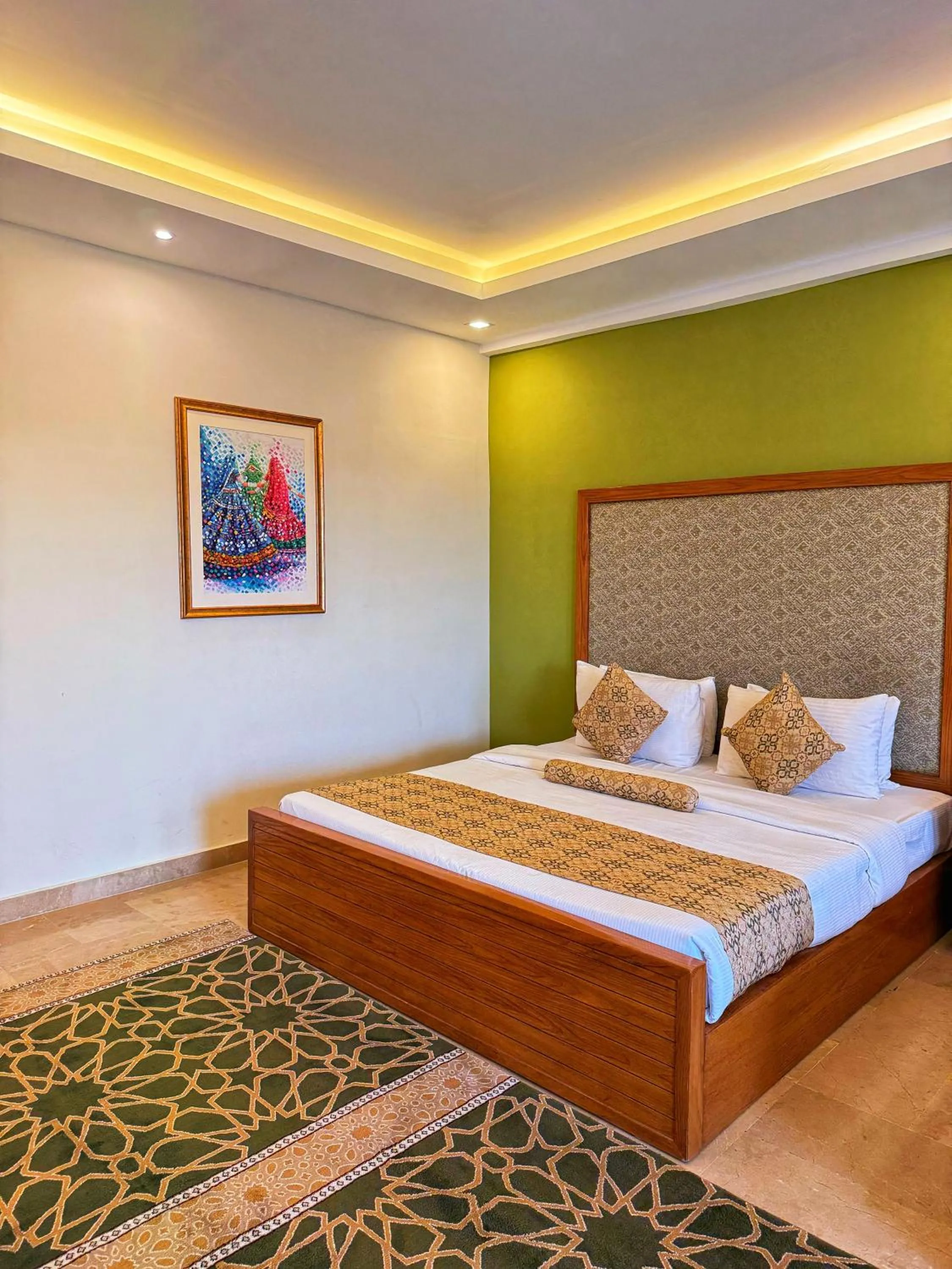 Bed in Grand Islamabad Hotel