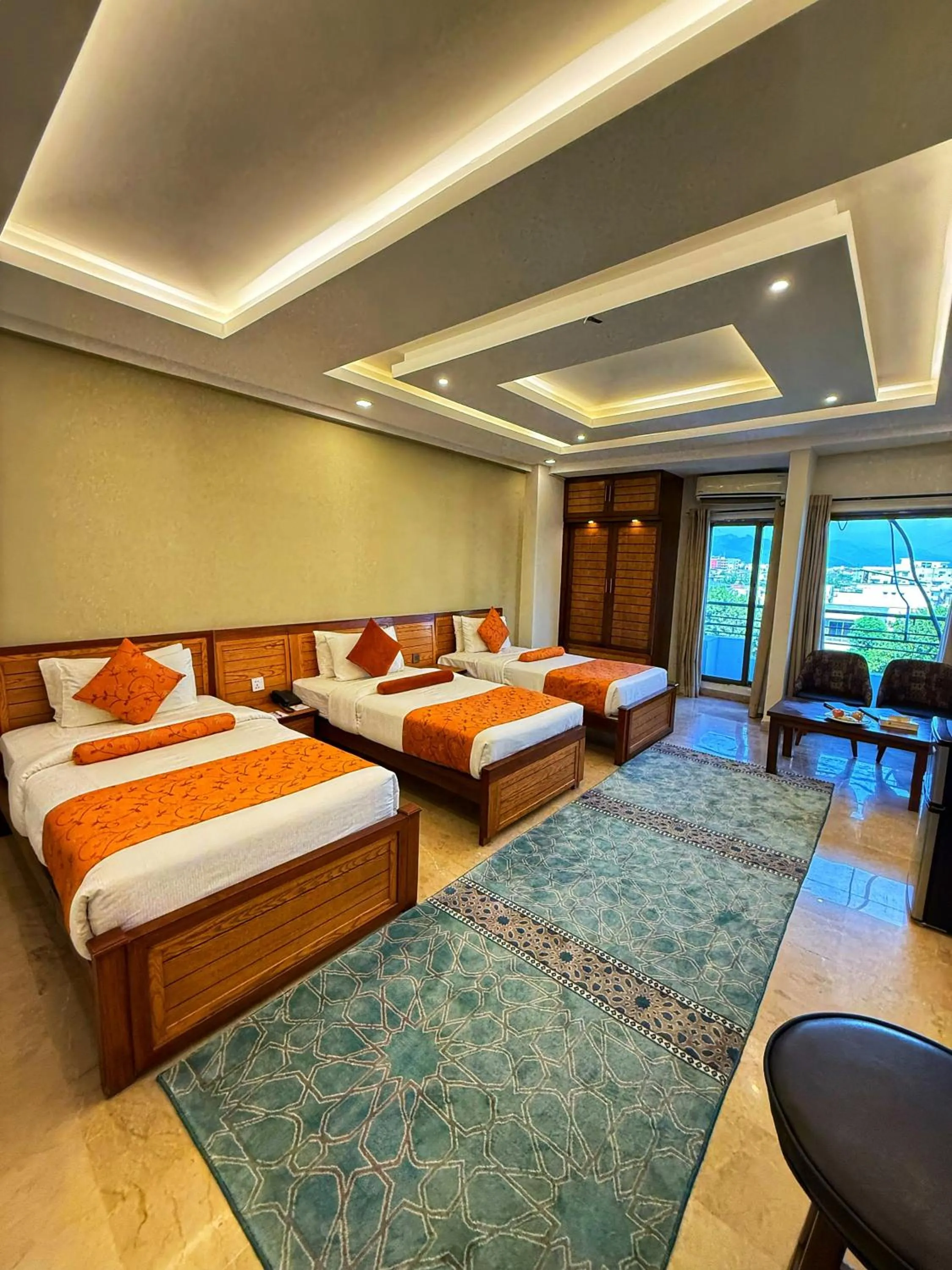 Bed in Grand Islamabad Hotel