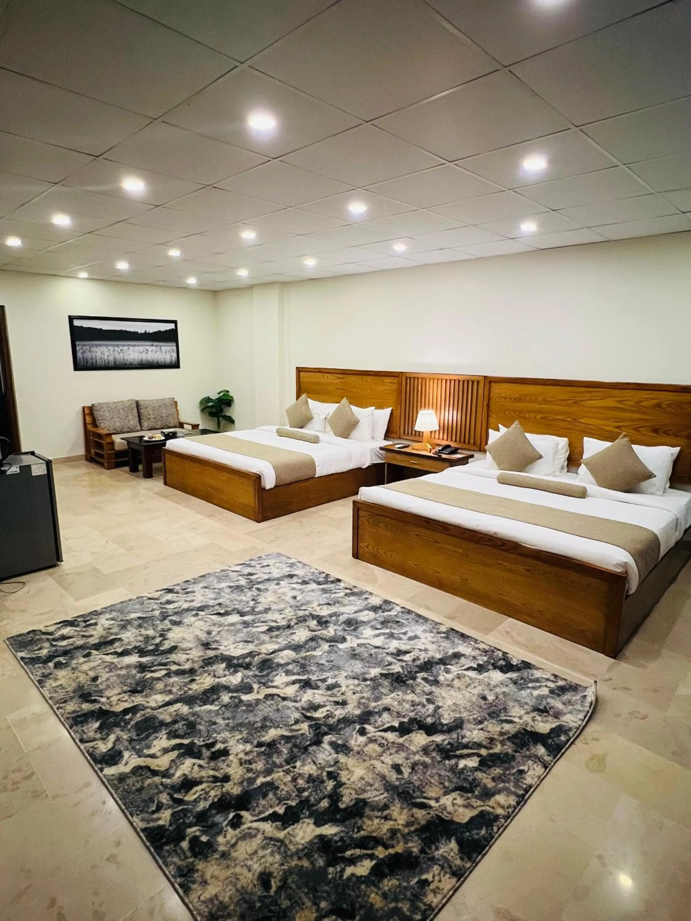 Bed in Grand Islamabad Hotel