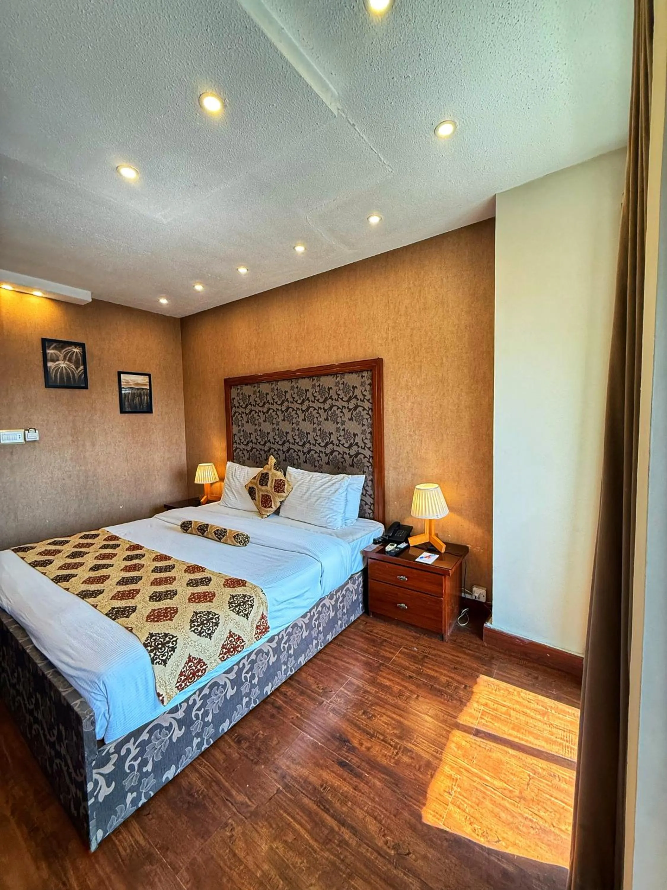 Bed in Grand Islamabad Hotel