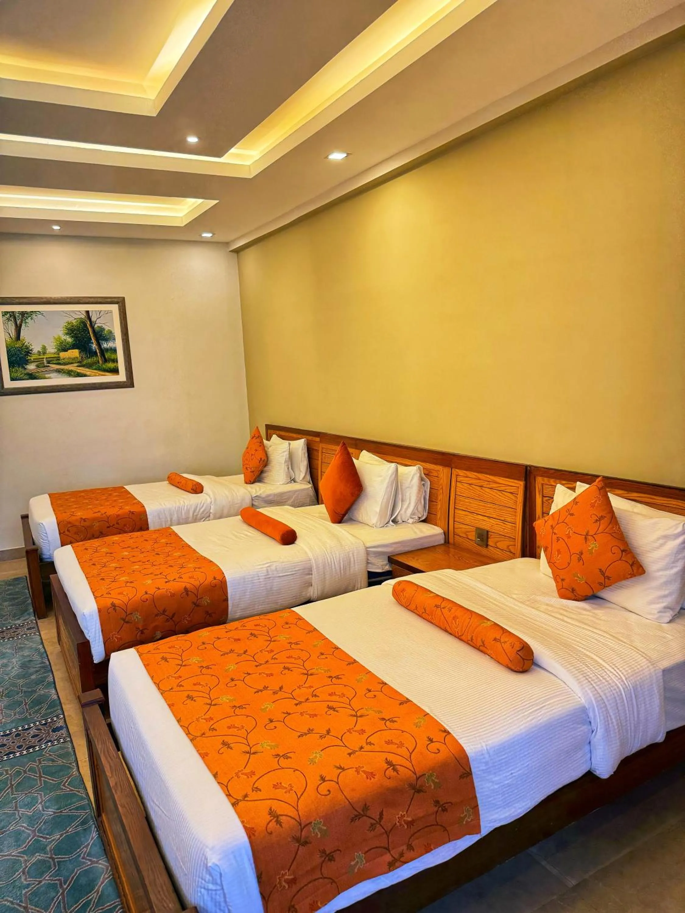 Bed in Grand Islamabad Hotel