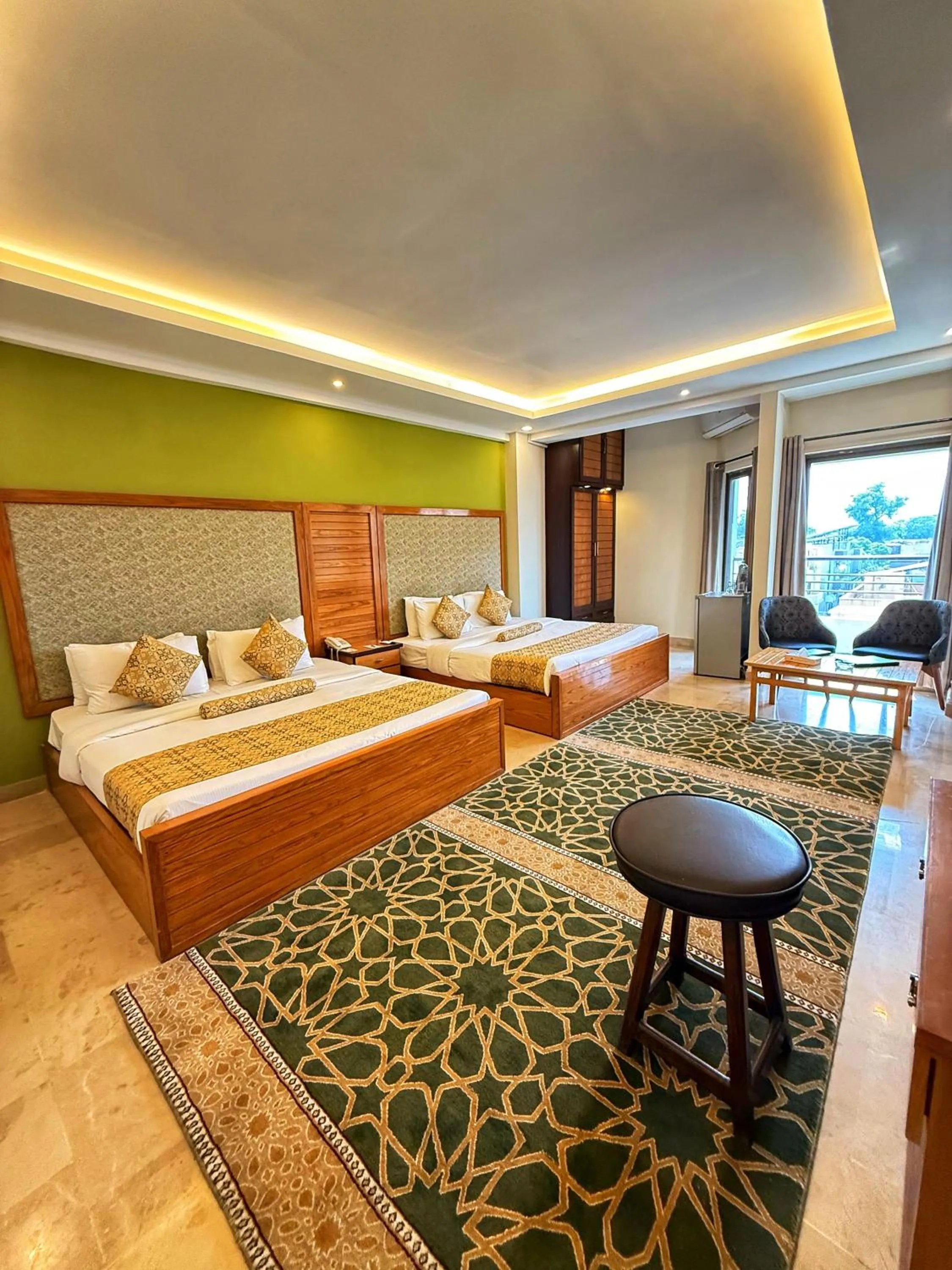 Bed in Grand Islamabad Hotel