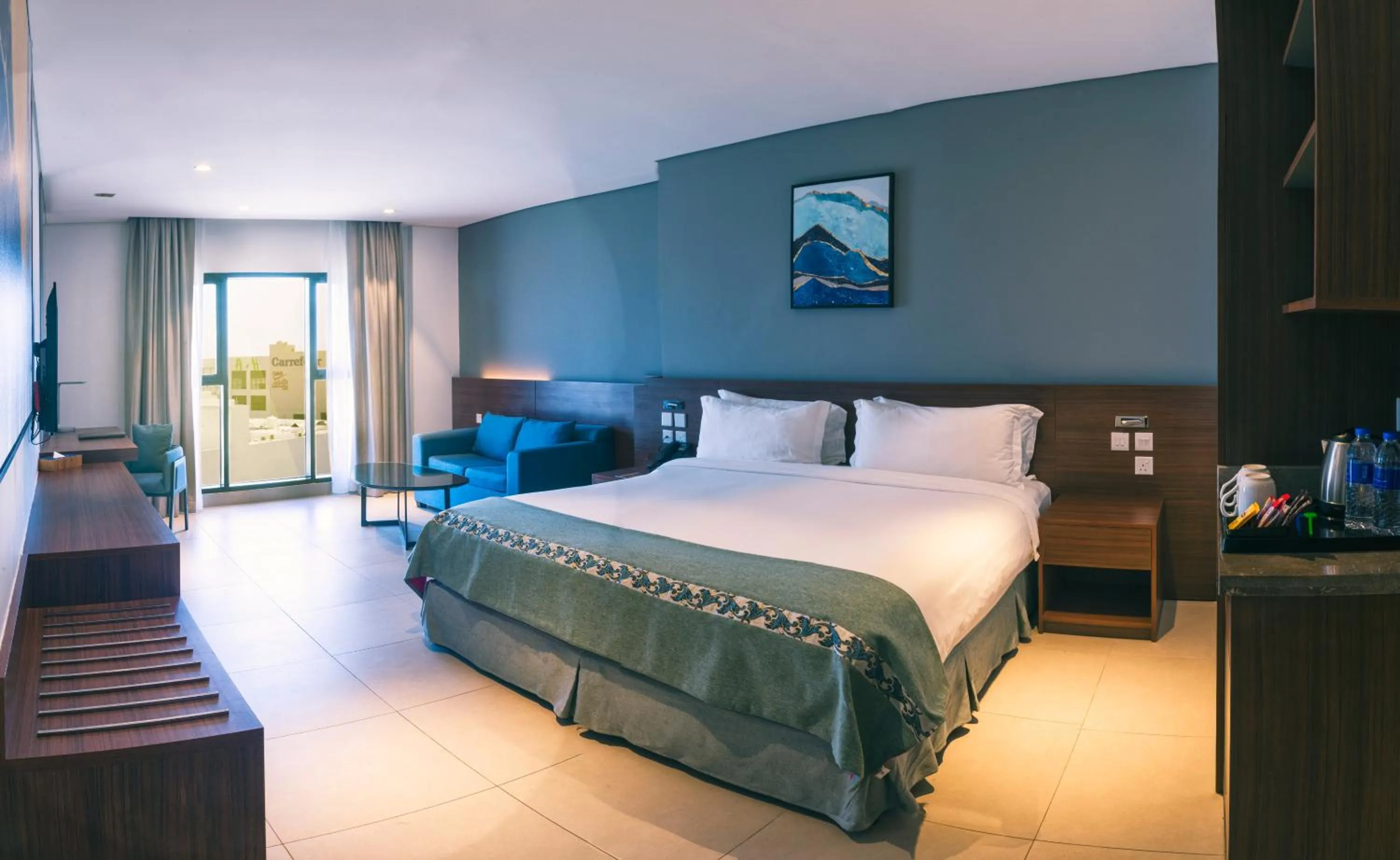 Living room, Bed in Boulevard Hotel Oman