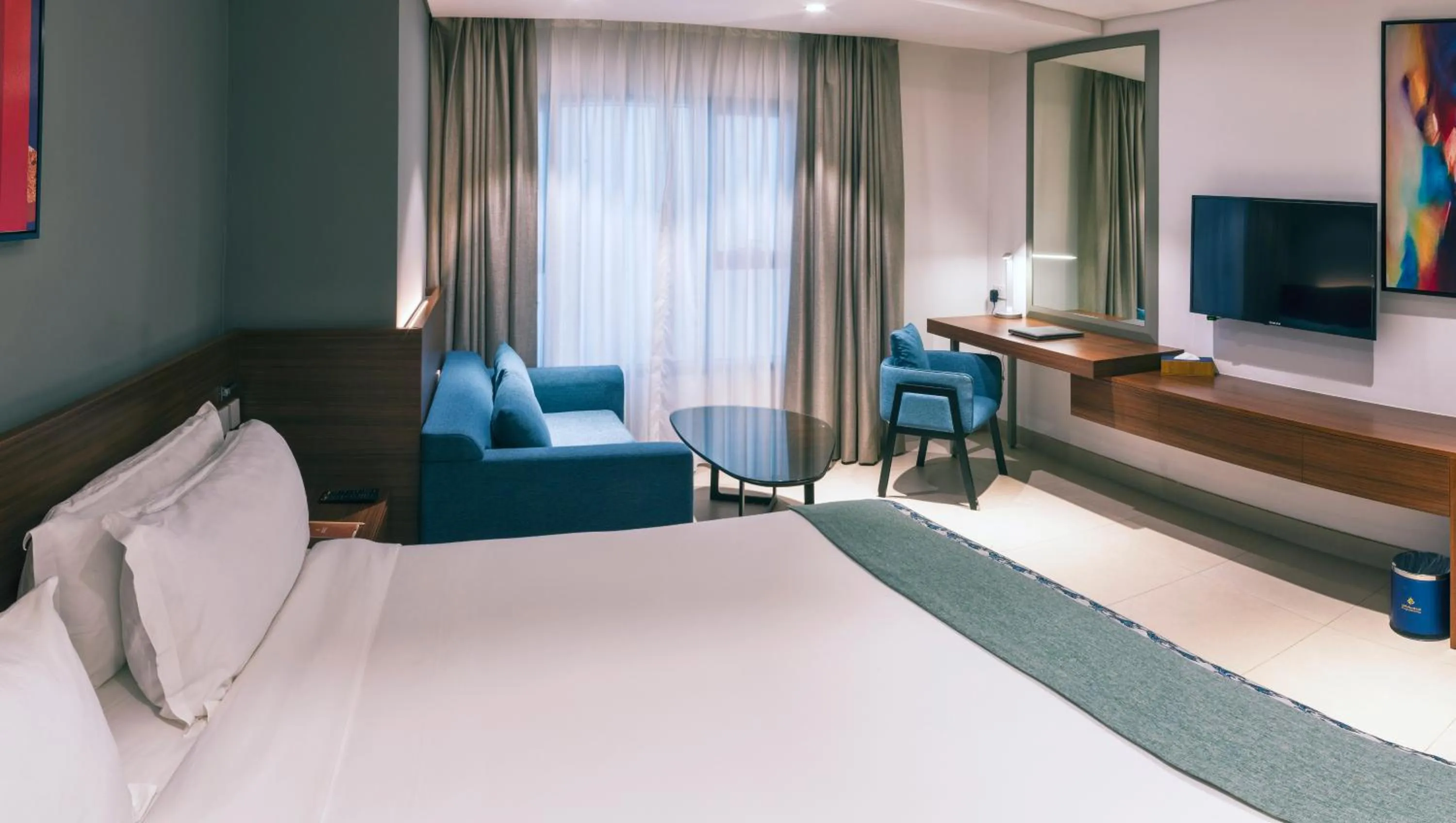 Seating area, Bed in Boulevard Hotel Oman