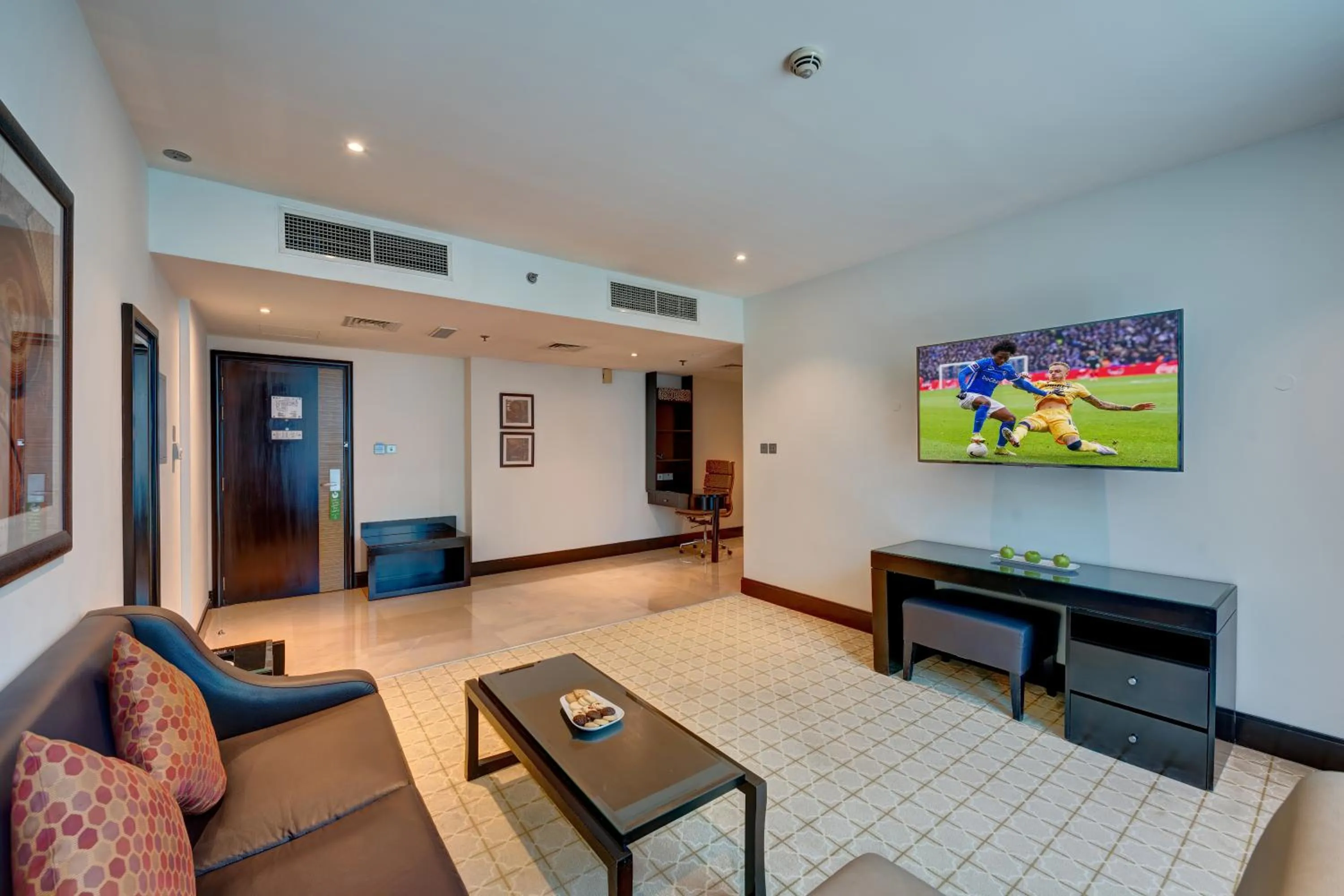 Living room in Holiday Inn Dubai Al Barsha by IHG