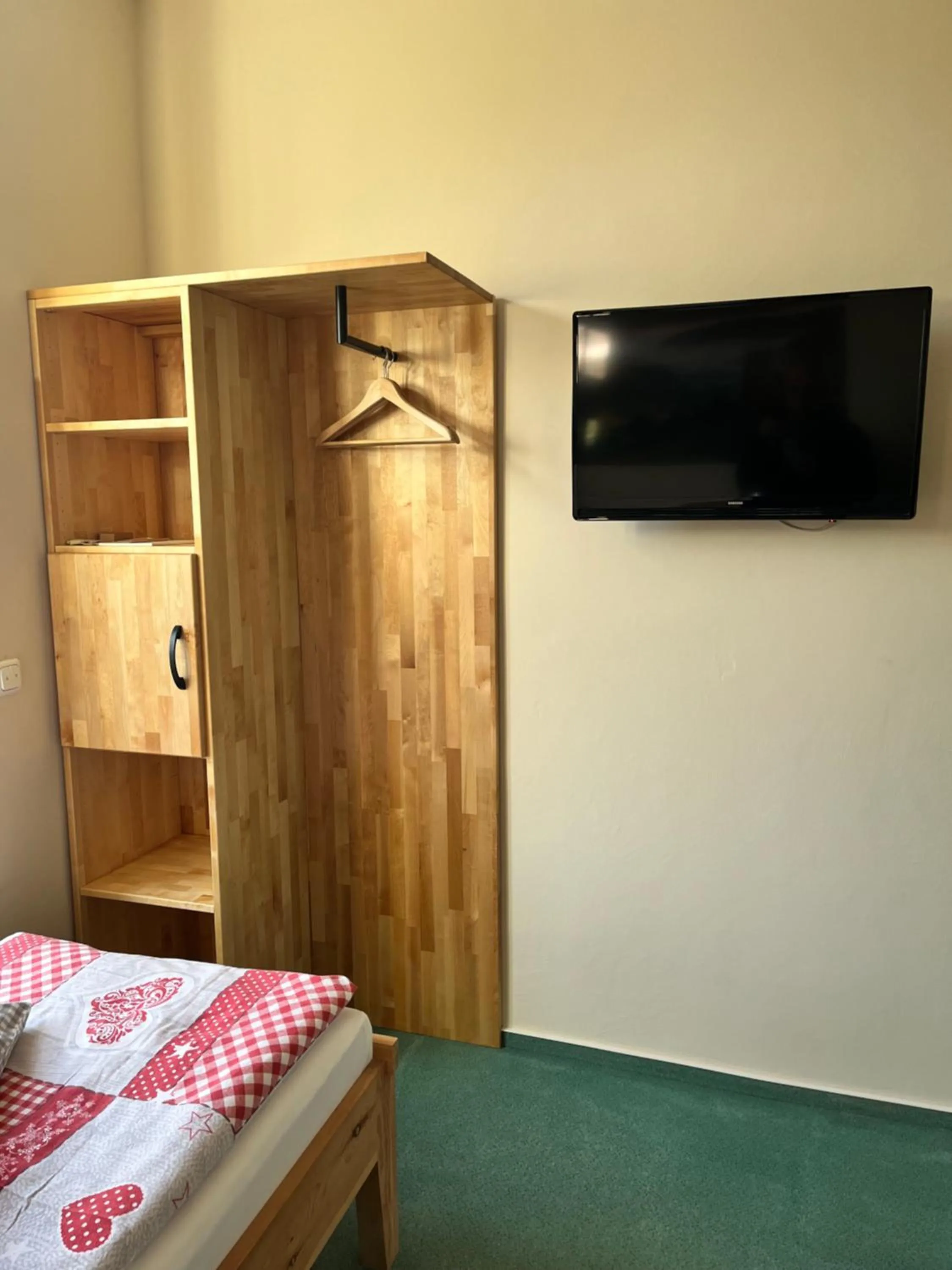 wardrobe, Bed in Biohotel Amadeus