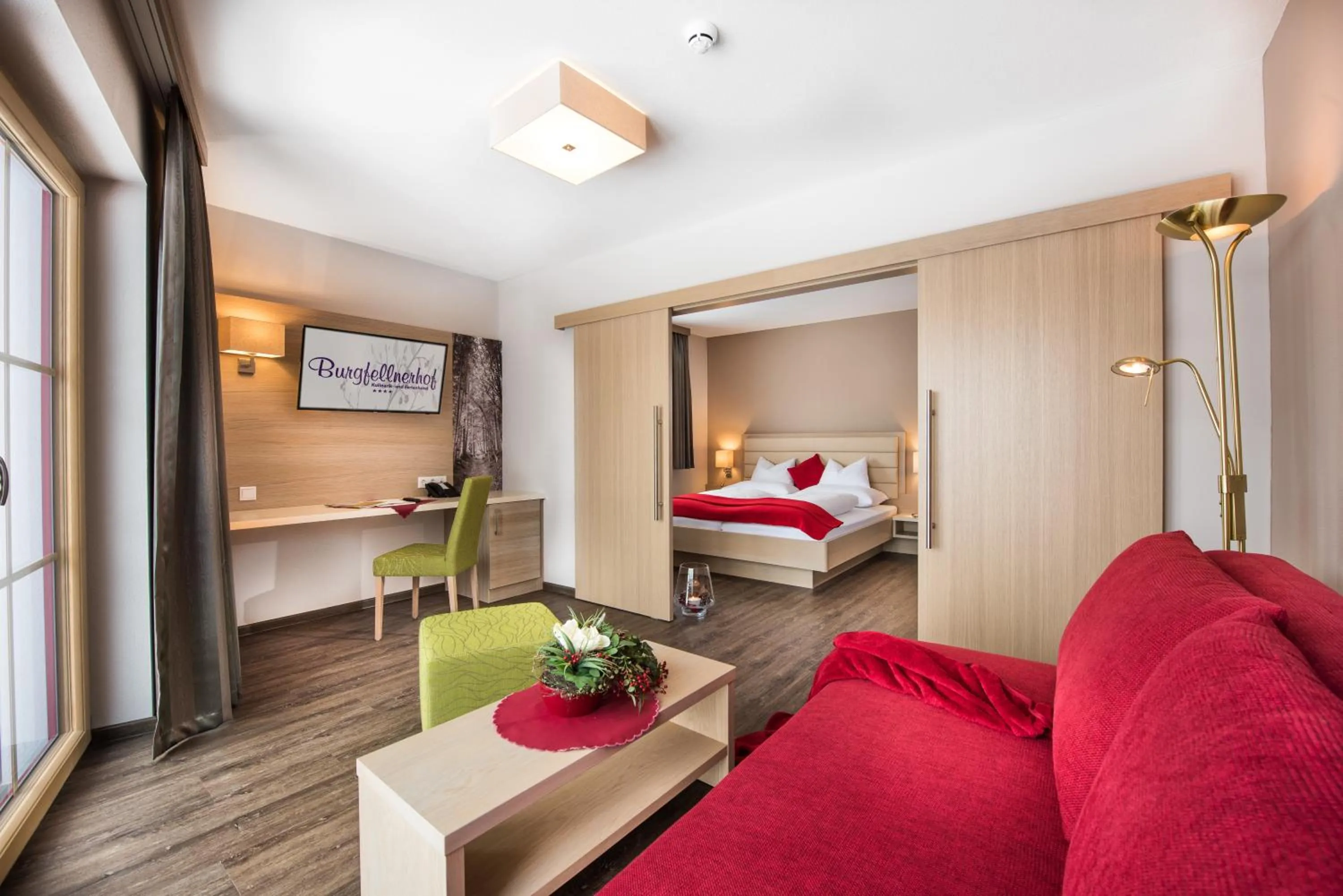 Communal lounge/ TV room, Bed in Der Burgfellnerhof - Adults Only