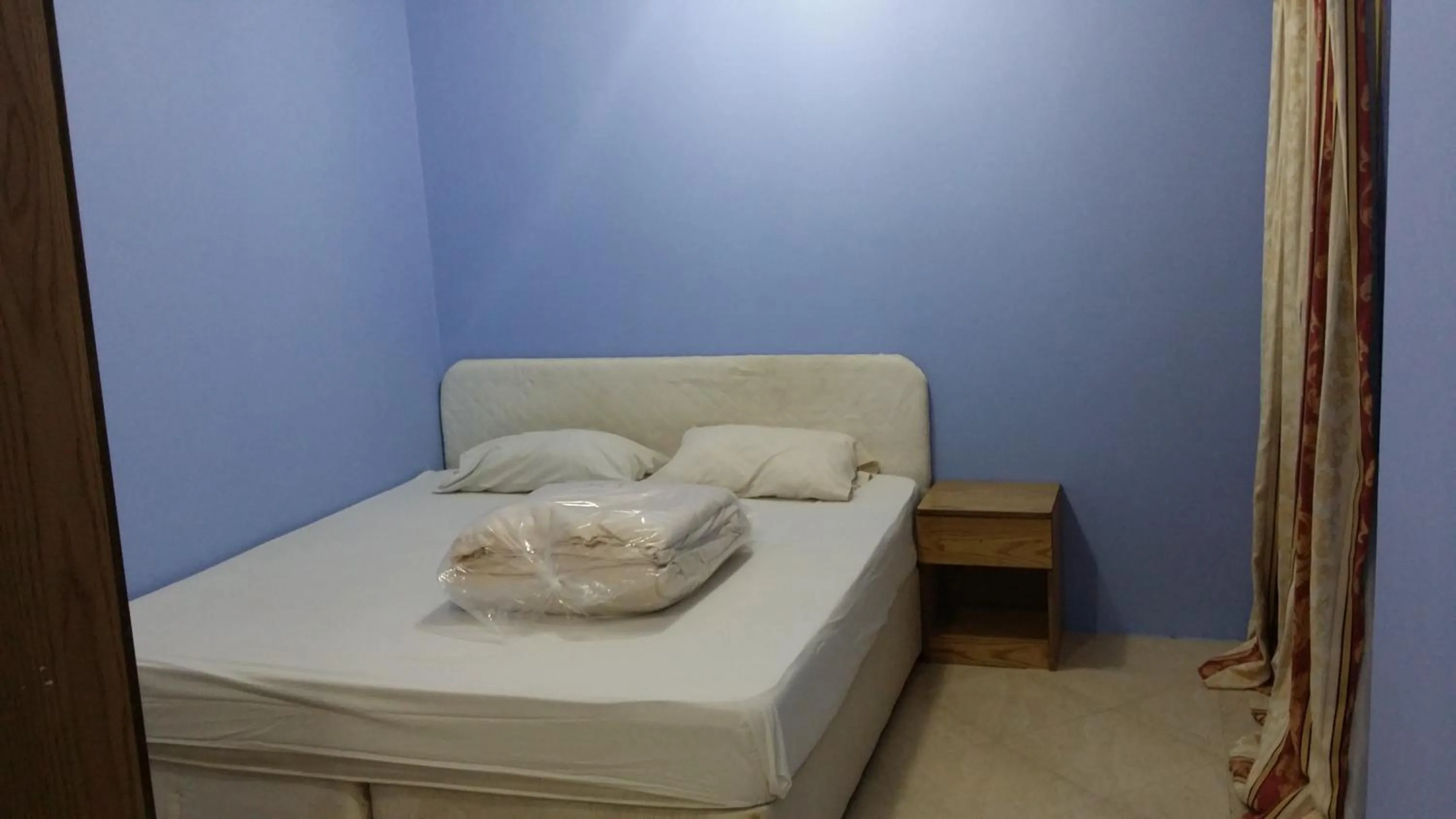 Bed in Red Tower Furnished Apartments