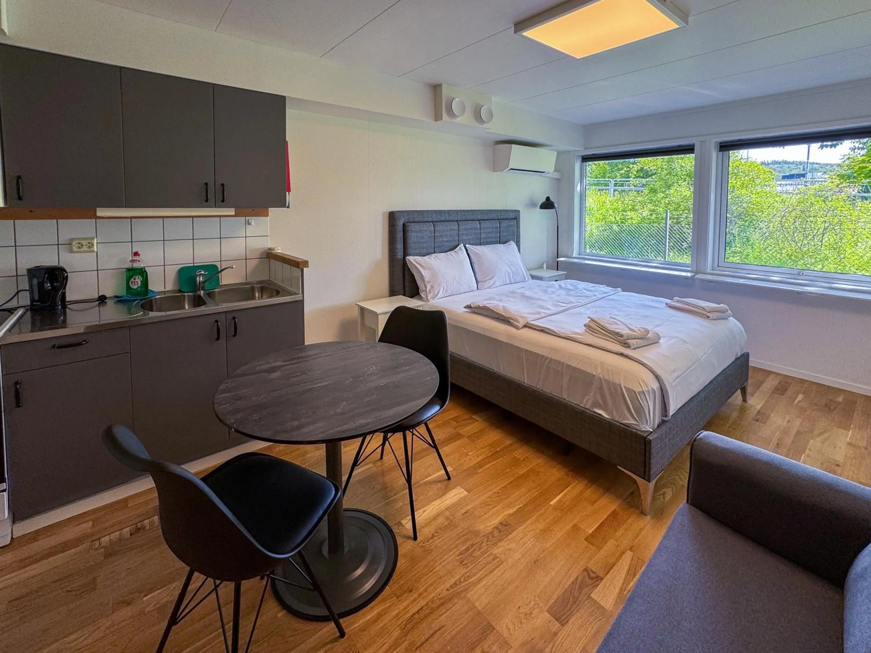 Kitchen or kitchenette, Bed in Jönköping Hotel Apartments