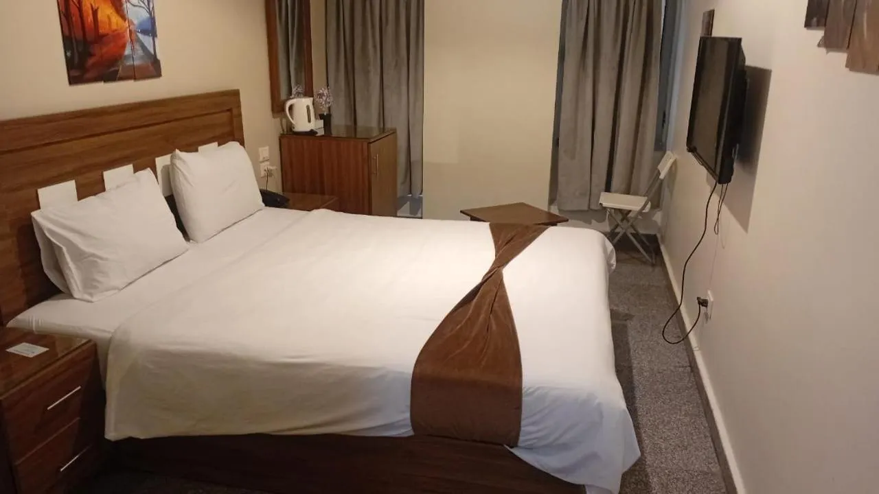 Bed in Royal Inn Residence
