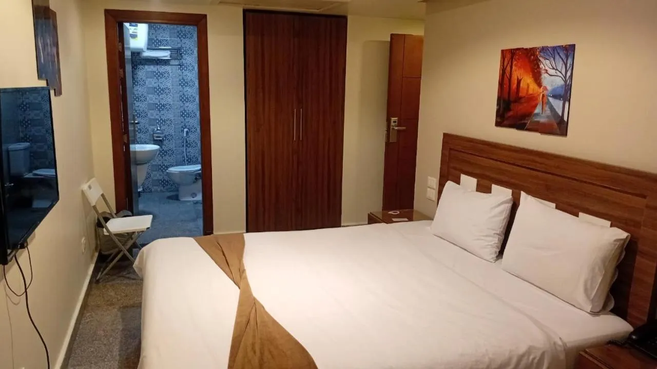 Bed in Royal Inn Residence