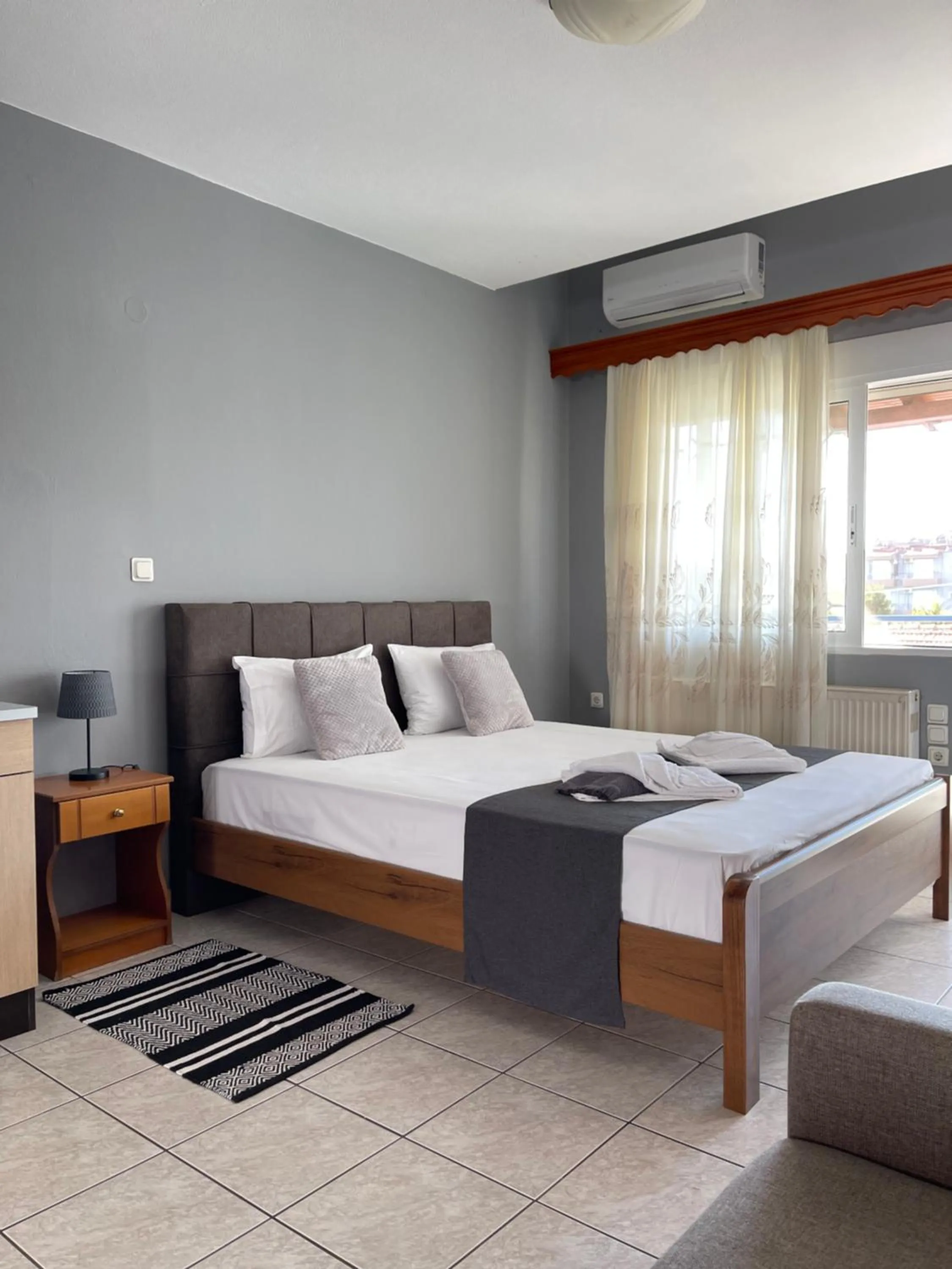 Bed in Artemis Hotel Apartments