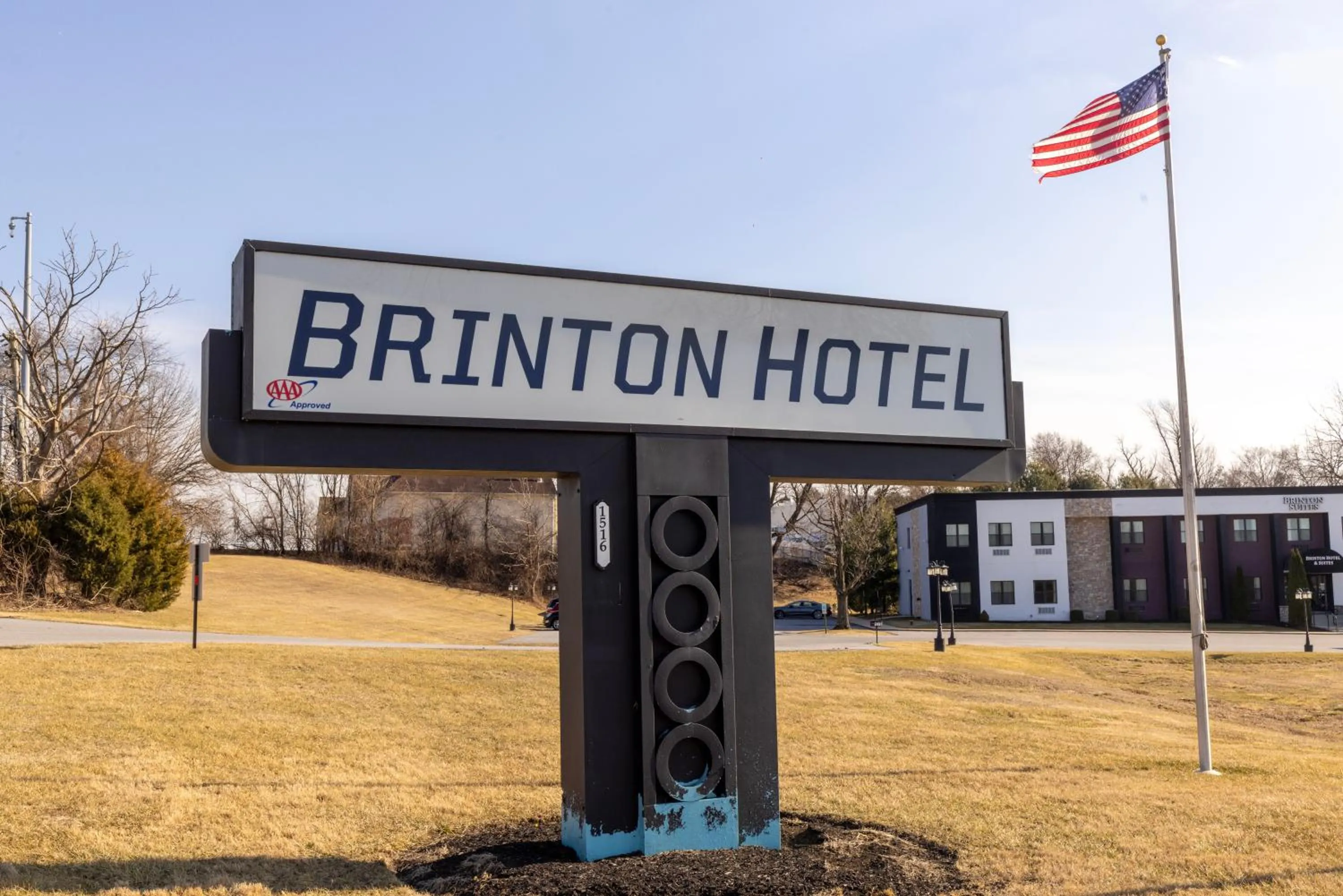 Property logo or sign in Brinton Suites