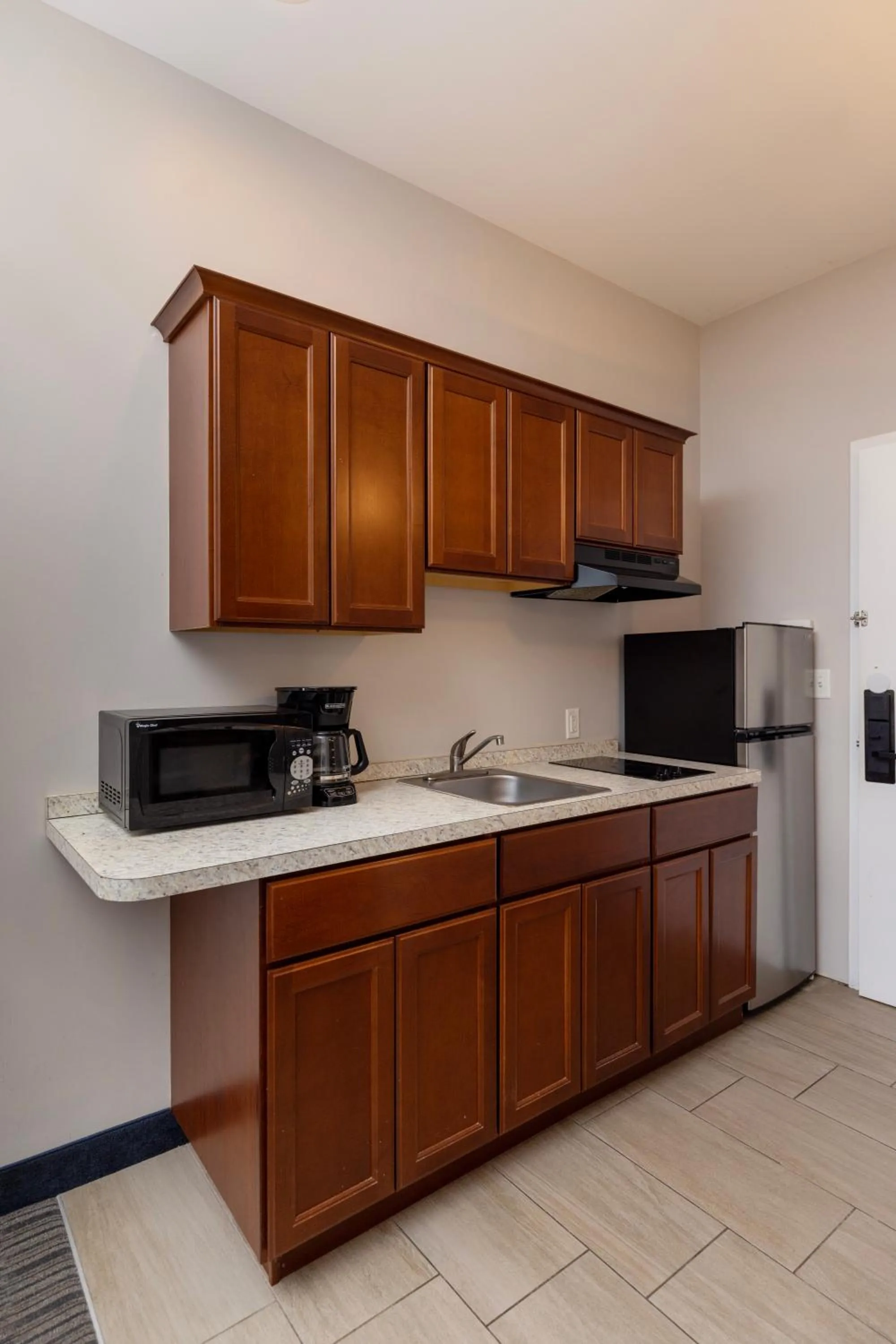 Kitchen or kitchenette in Brinton Suites