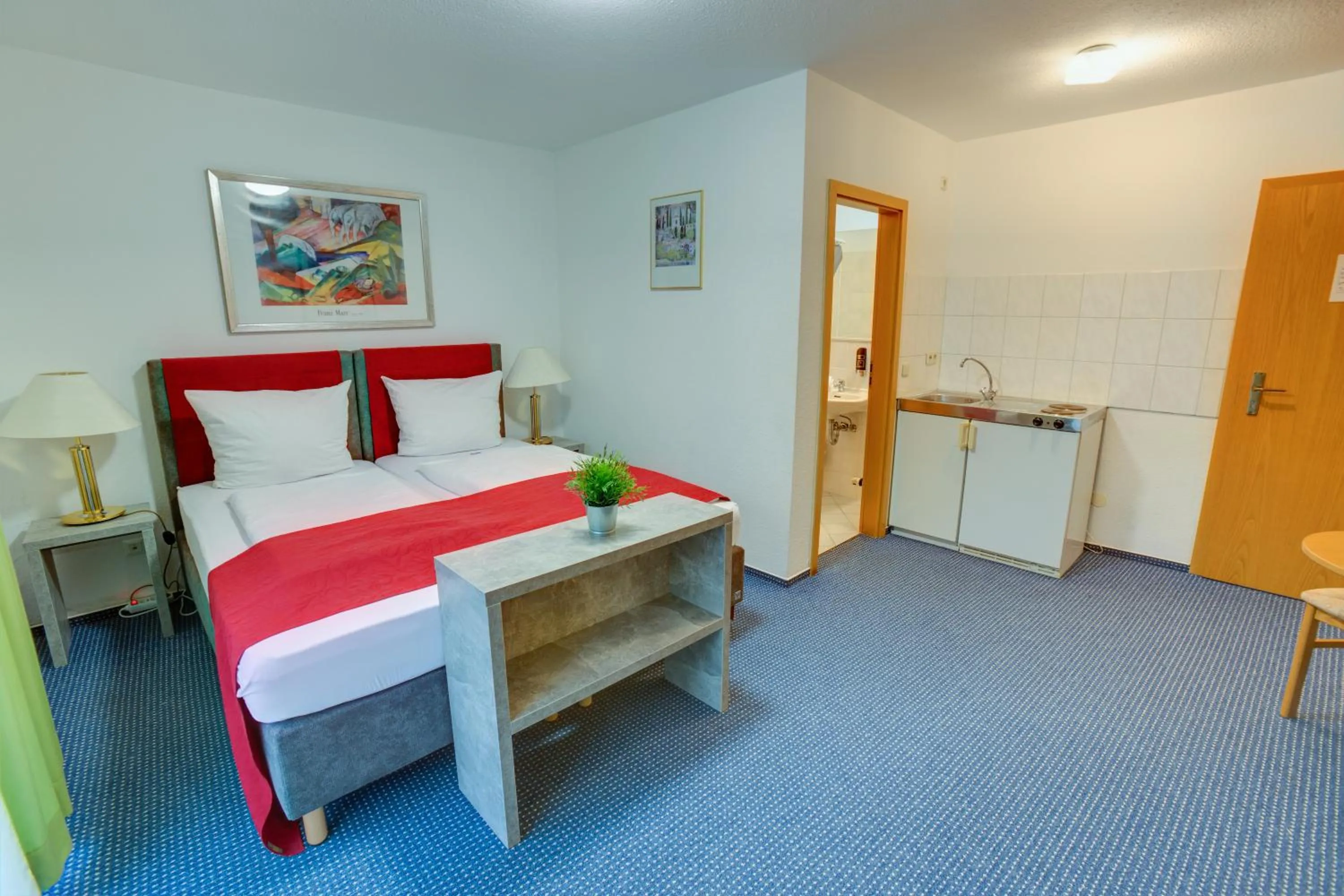 Bed in Hotel Leo Mühlhausen