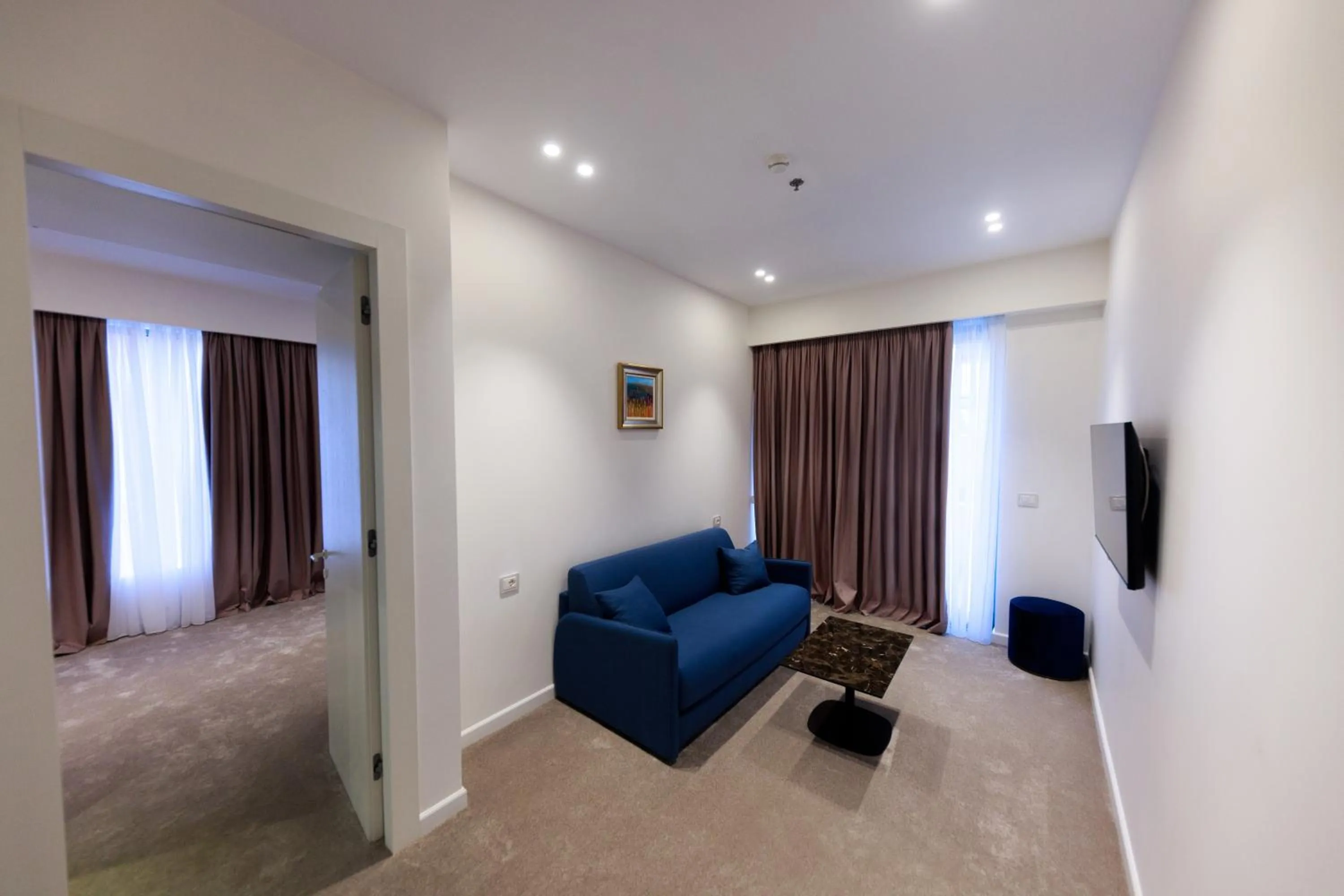 Communal lounge/ TV room in Habitat Hotel Tirana