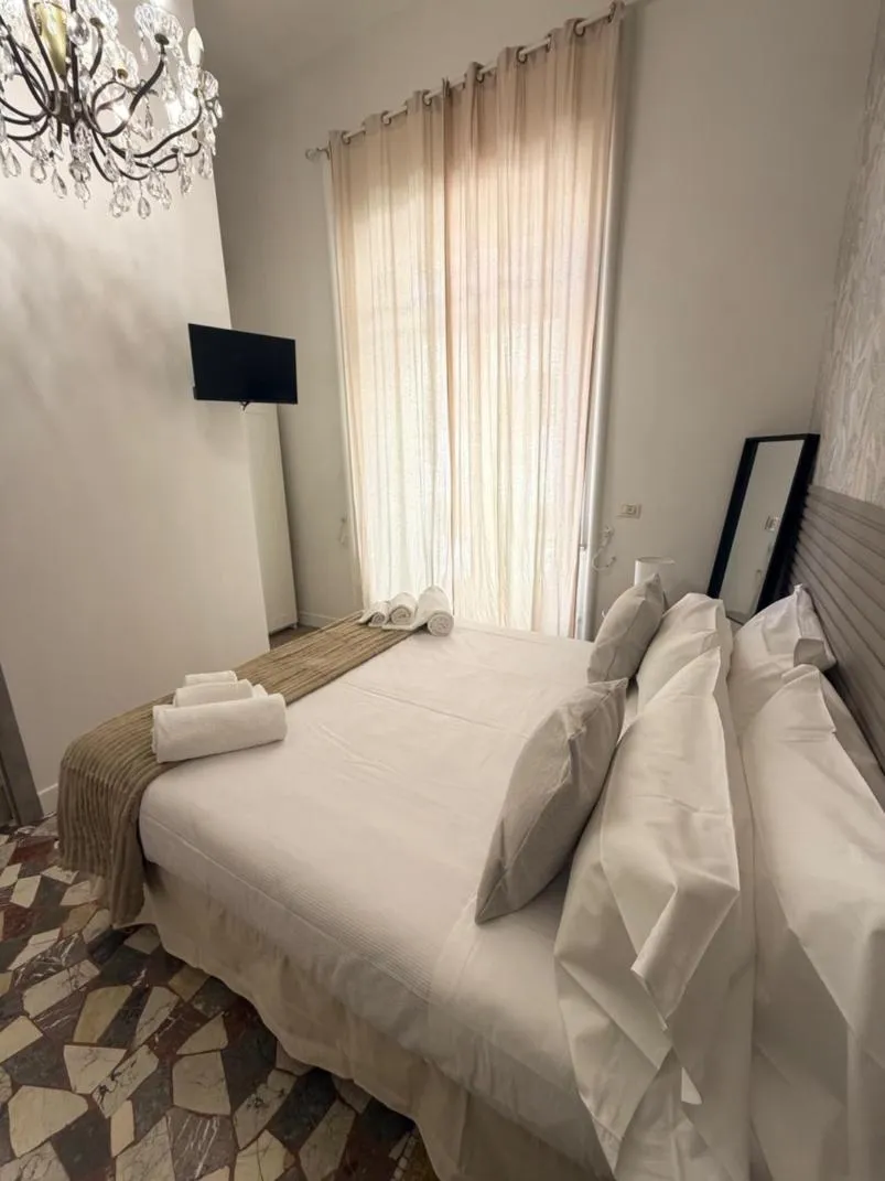 Bed in Joy's Rooms Ortigia