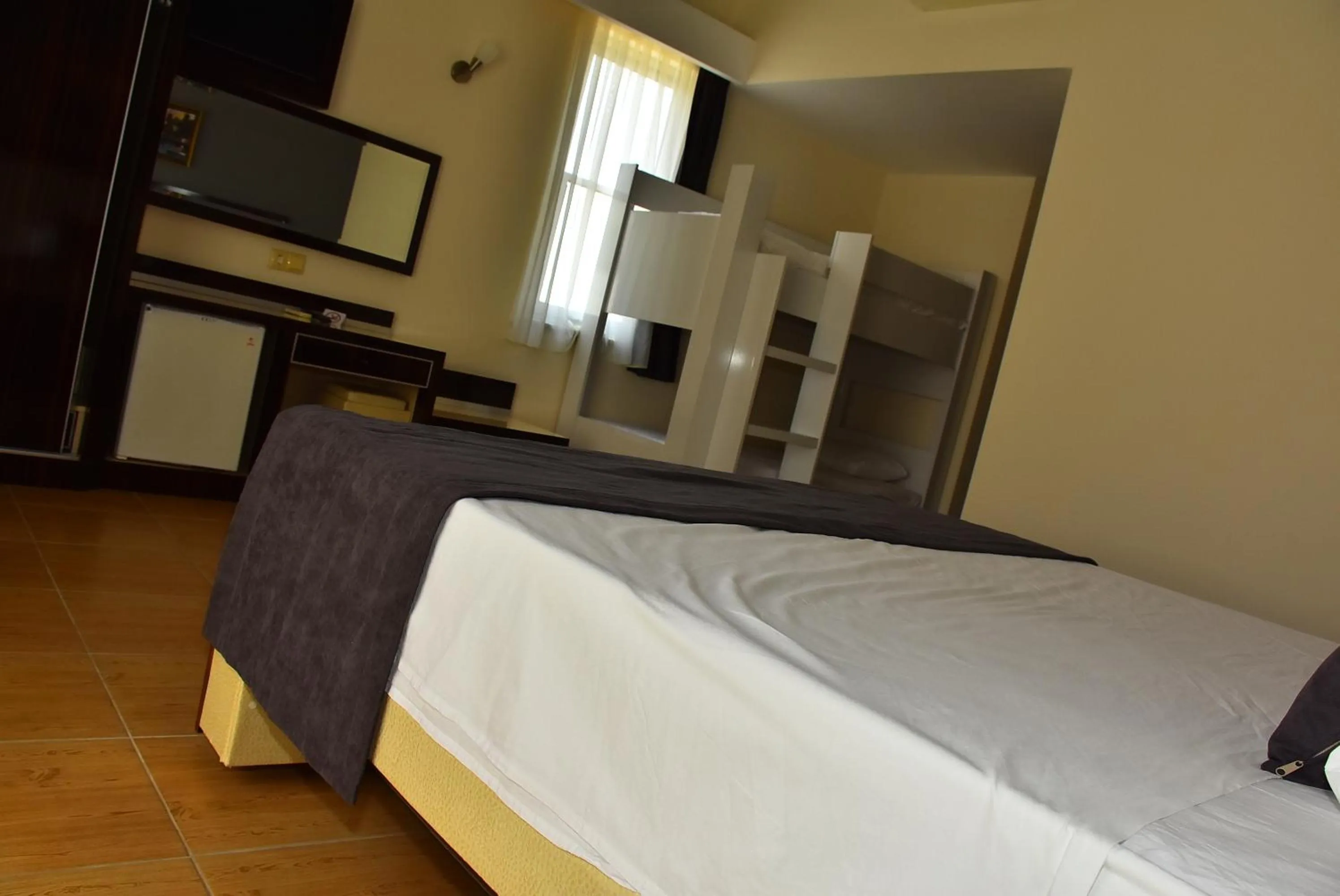 Bed in Nora Suit Hotel