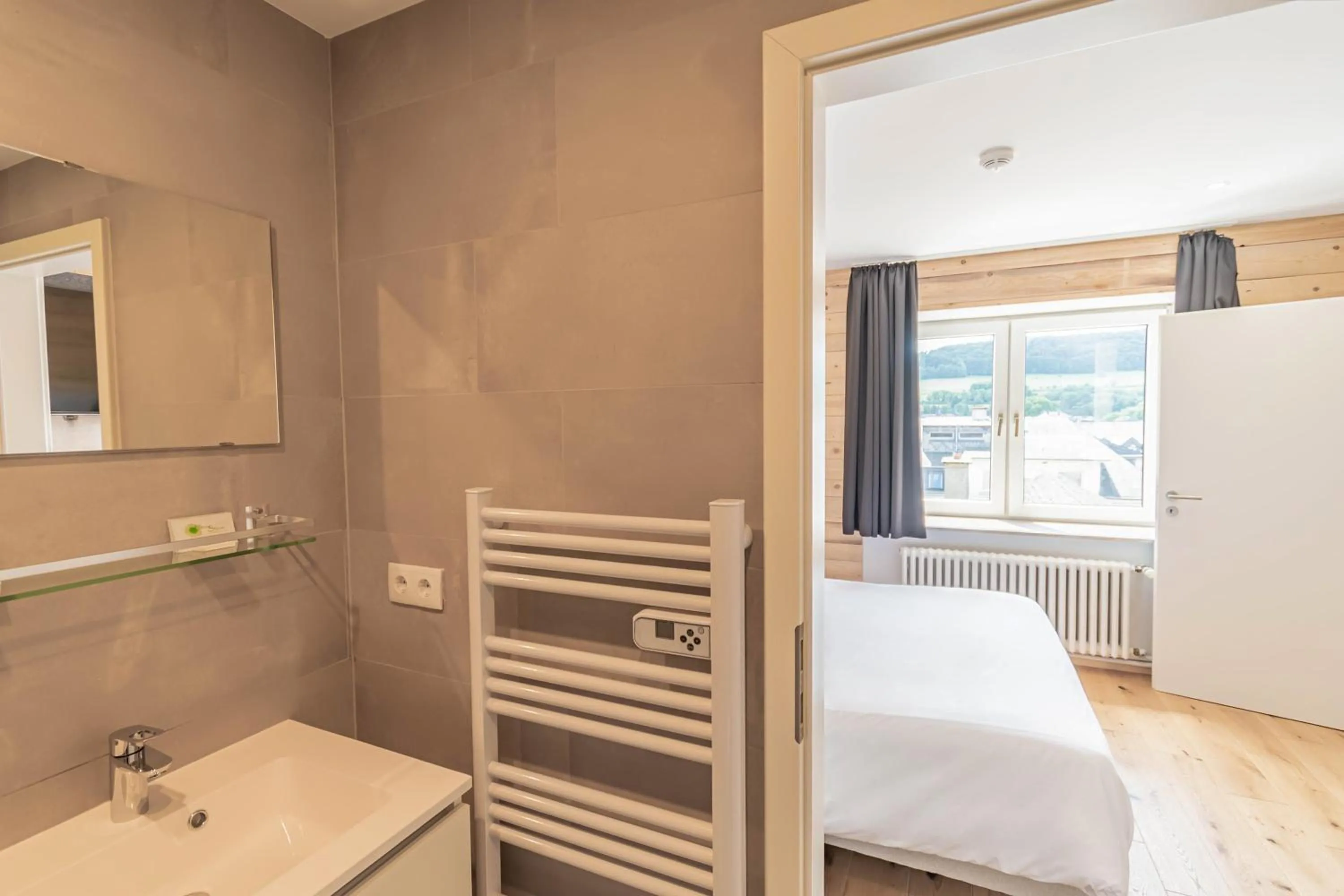 Bathroom, Bed in Esplanade Hotel