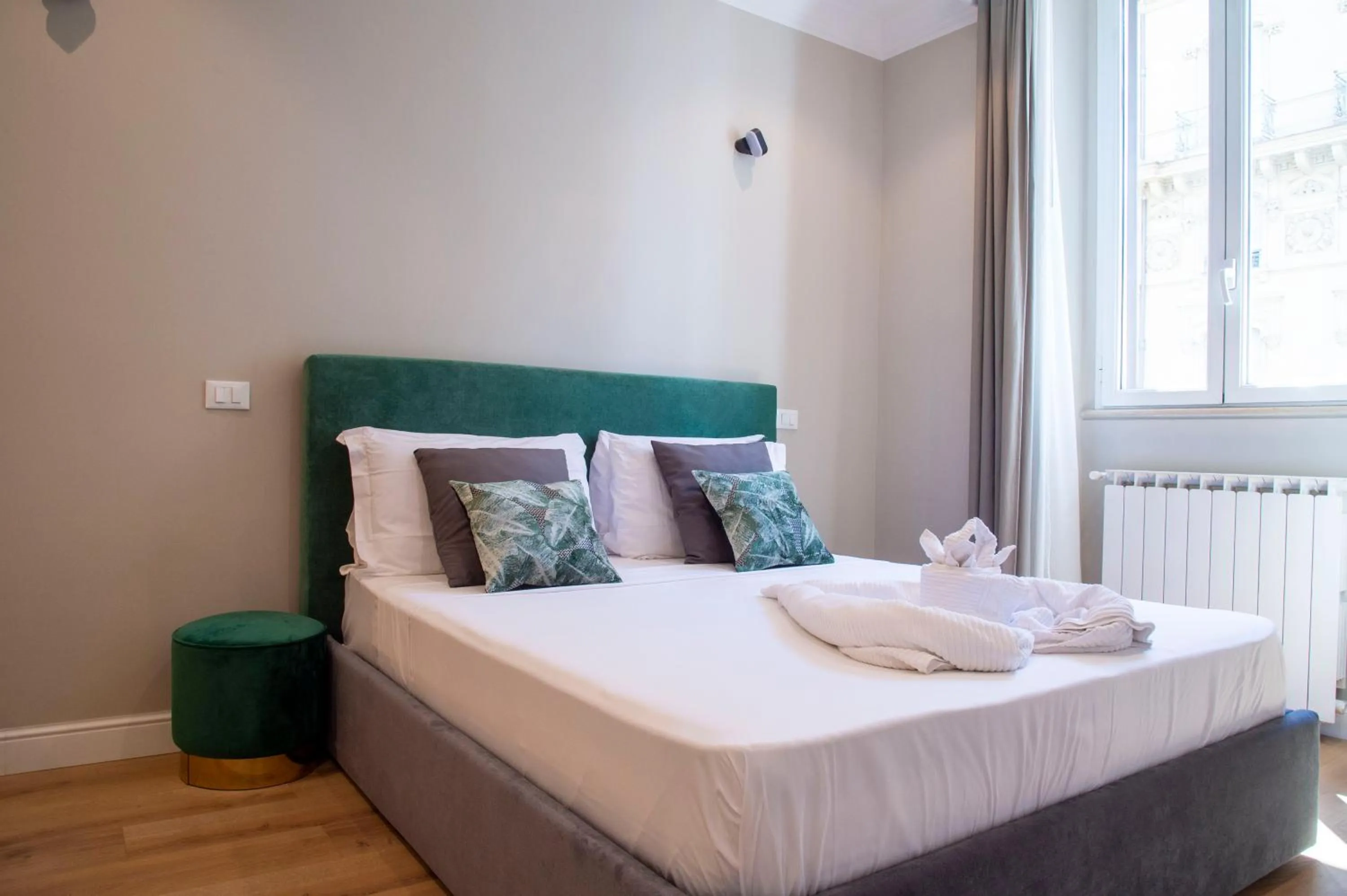 Bed in AD Suites Tritone