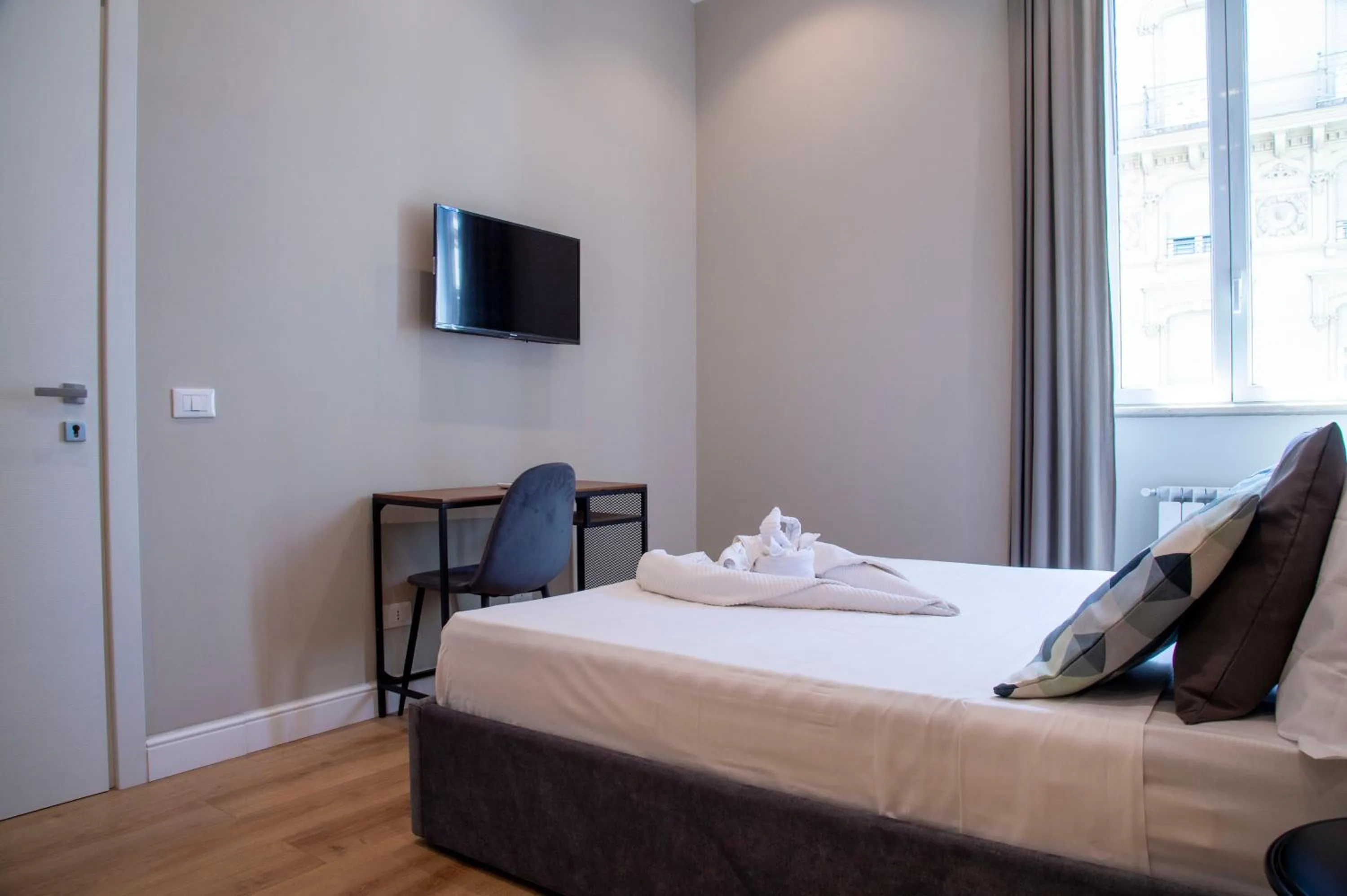 Bed in AD Suites Tritone