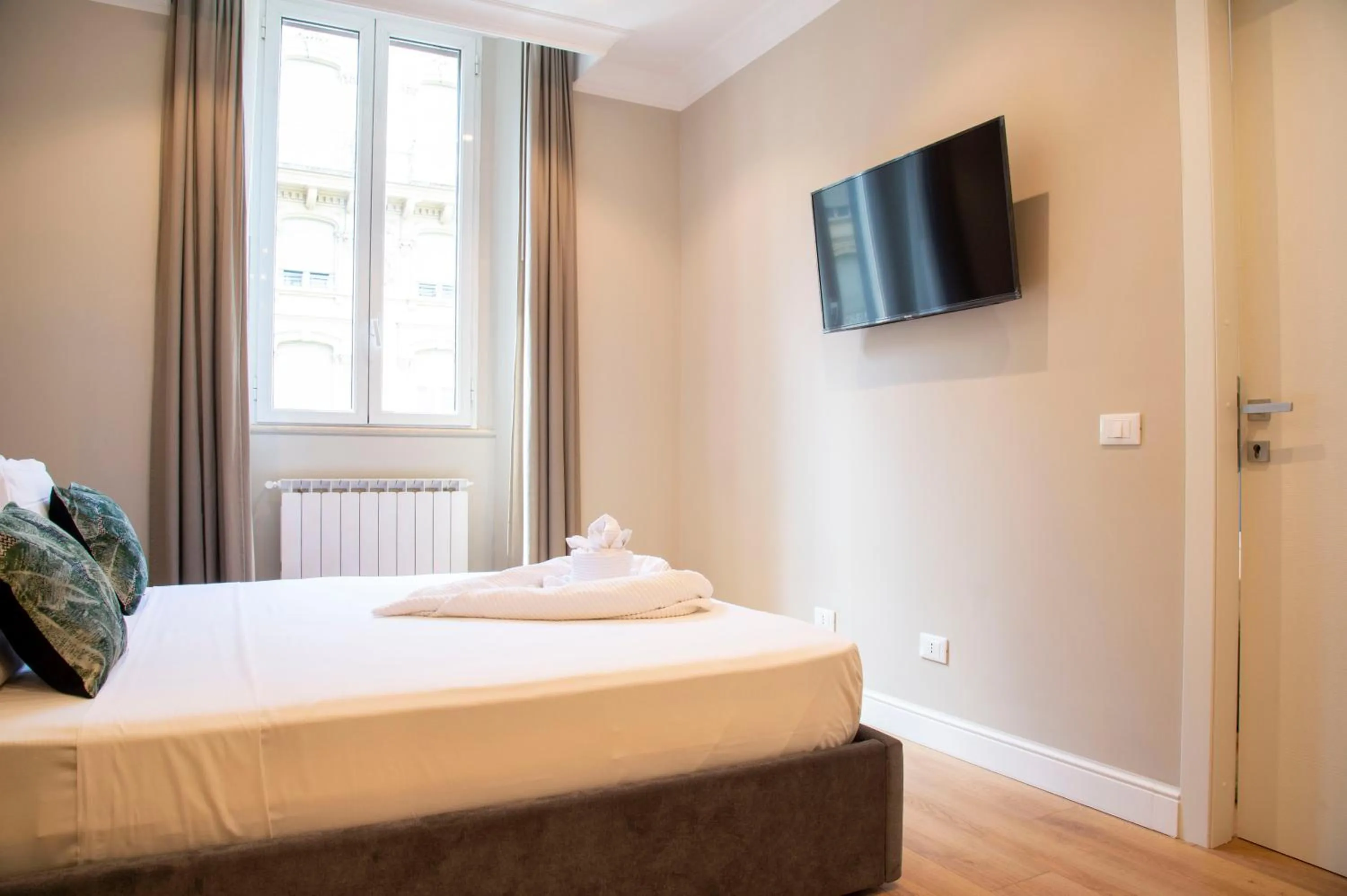 Bed in AD Suites Tritone