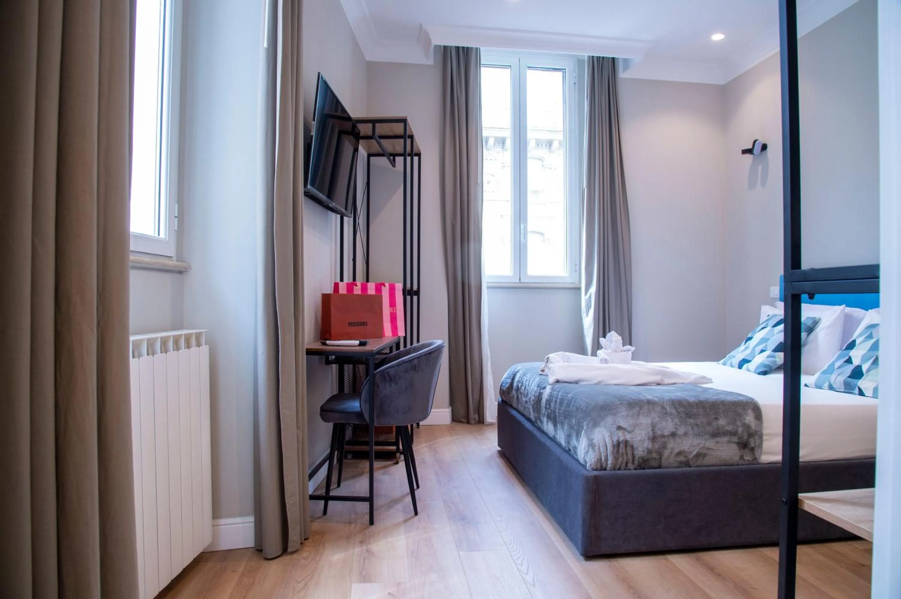 Bed in AD Suites Tritone