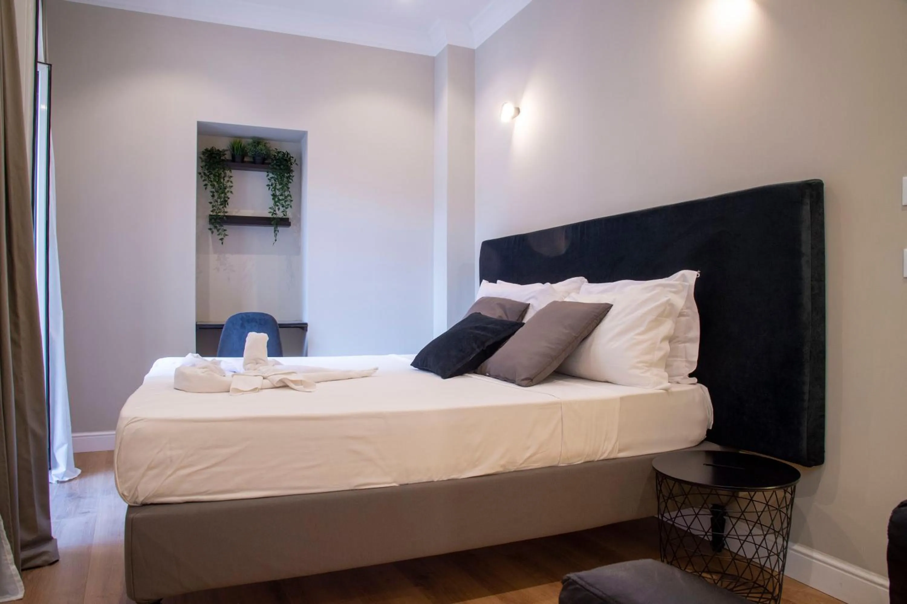 Bed in AD Suites Tritone