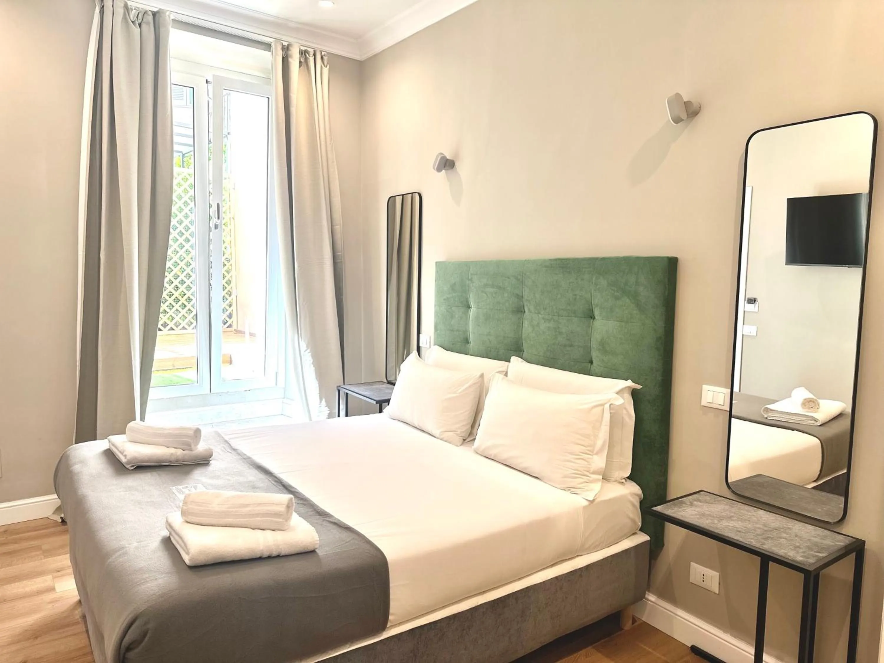 Bed in AD Suites Tritone