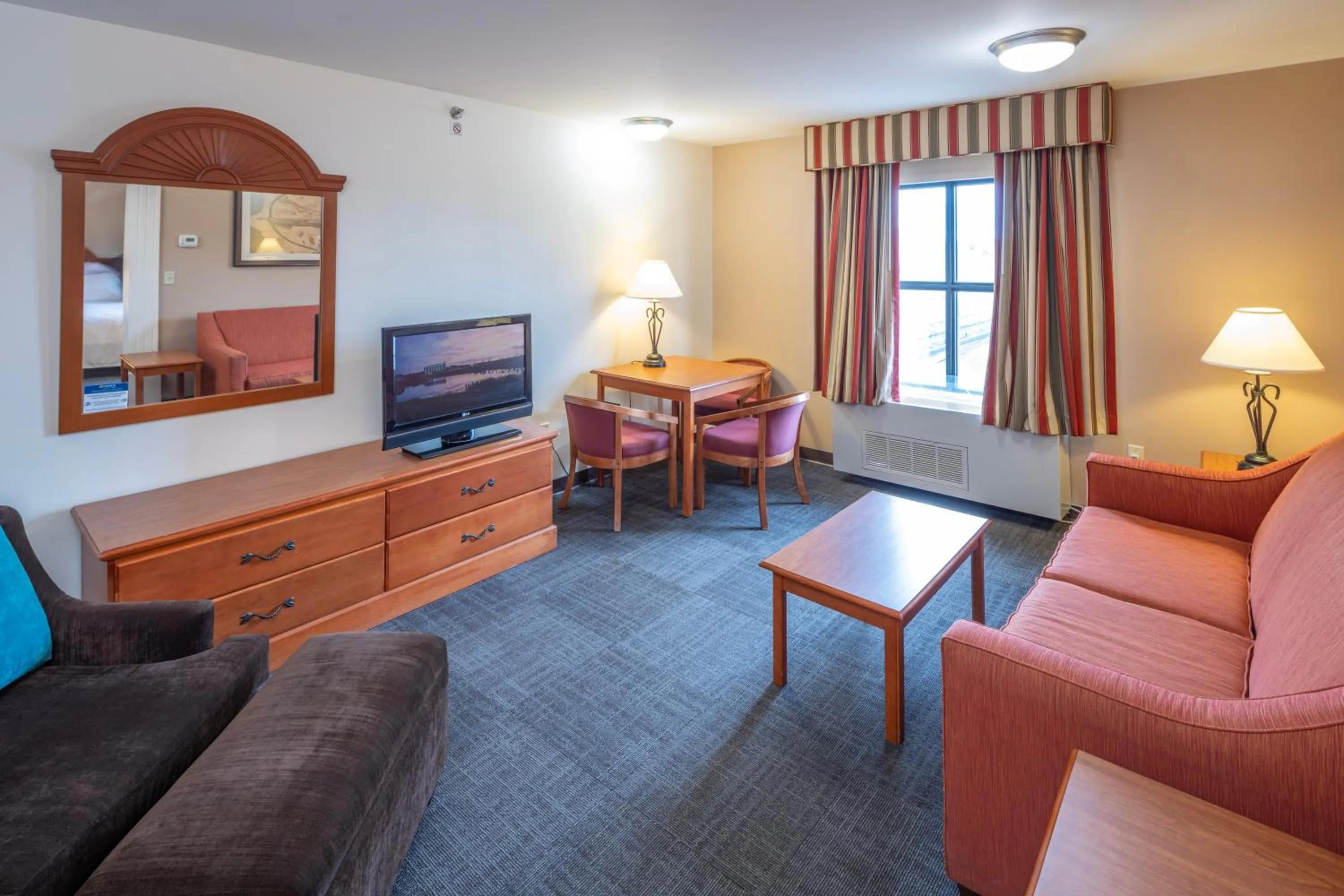 Living room in Akwesasne Mohawk Casino Resort and Players Inn Hotel -formerly Comfort Inn and Suites Hogansburg NY