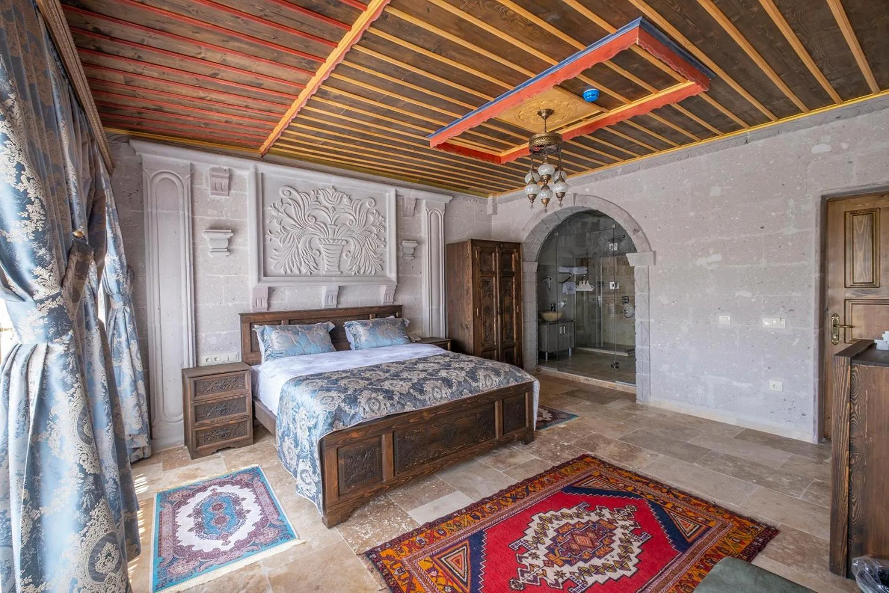 Bed in Underground Cave Suites Hotel