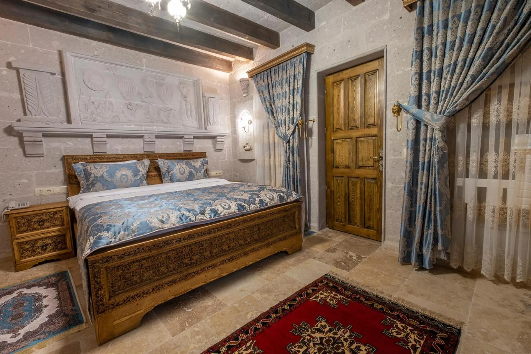 Photo of the whole room, Bed in Underground Cave Suites Hotel