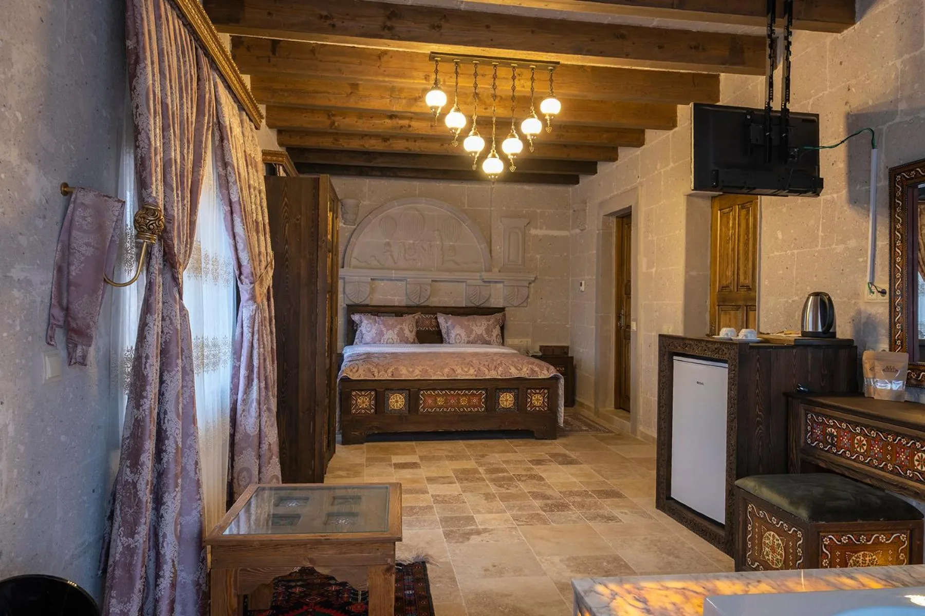 Bed in Underground Cave Suites Hotel