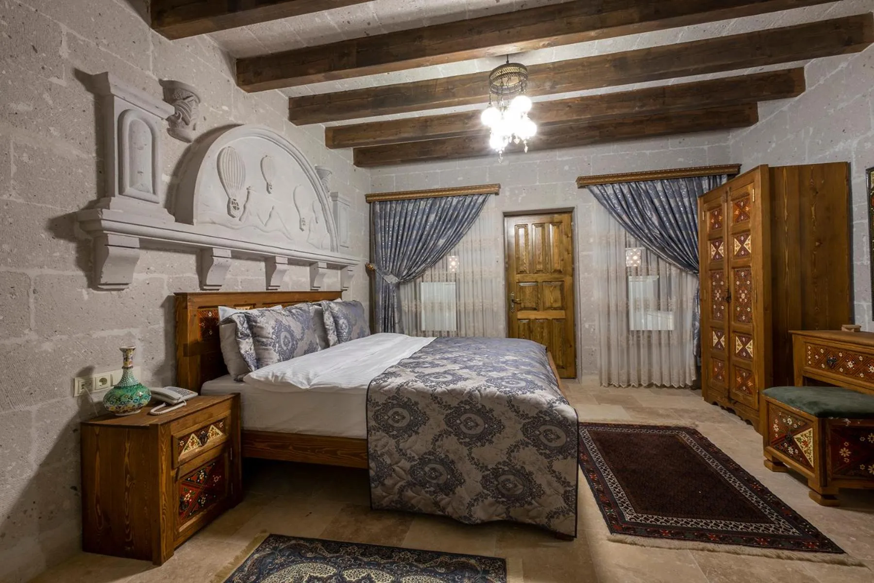 Bed in Underground Cave Suites Hotel